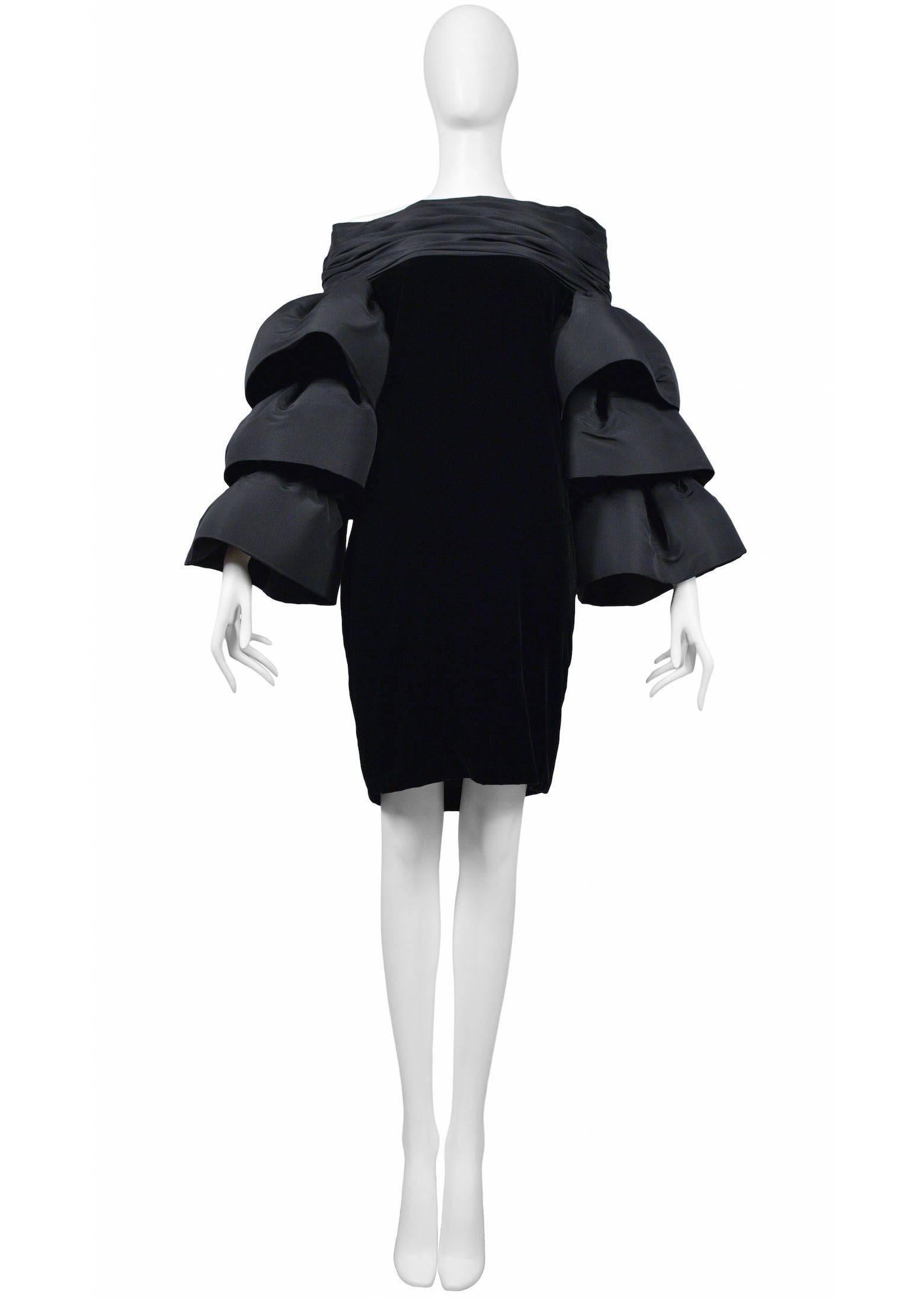Pierre Cardin Couture black silk velvet dress with exaggerated black taffeta tiered sleeves. Strapless neckline. Circa, 1986-1993.
