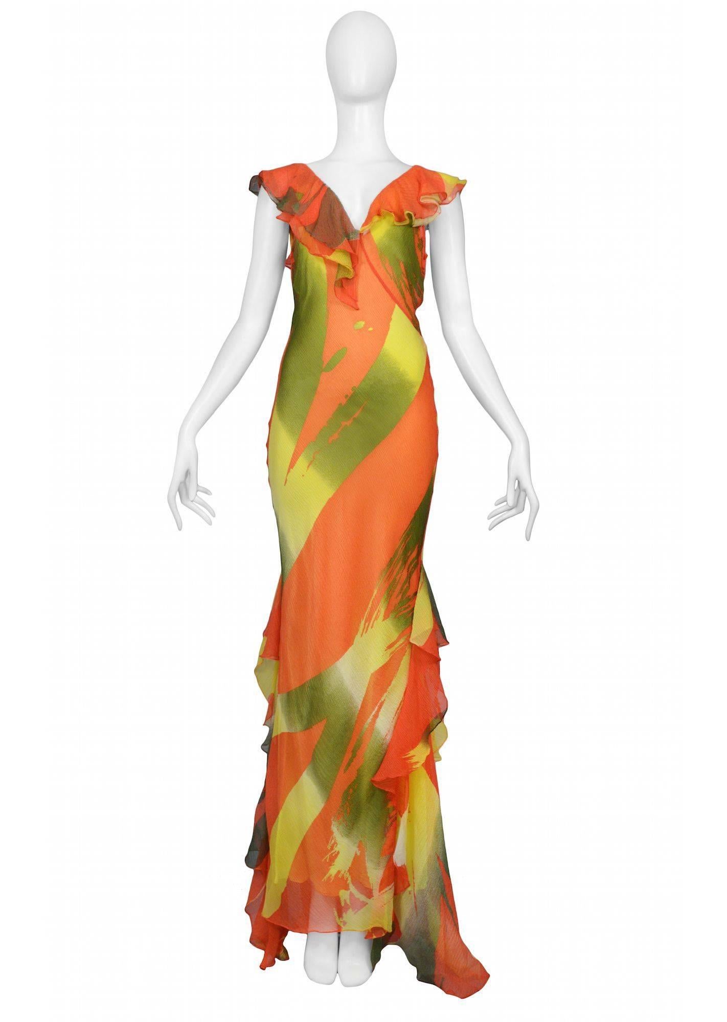 Vintage Stephen Burrows vibrant orange, yellow, and green abstract print bias cut chiffon evening gown with V-neckline, ruffles and lime satin slip dress.

Excellent Condition.

Size 2