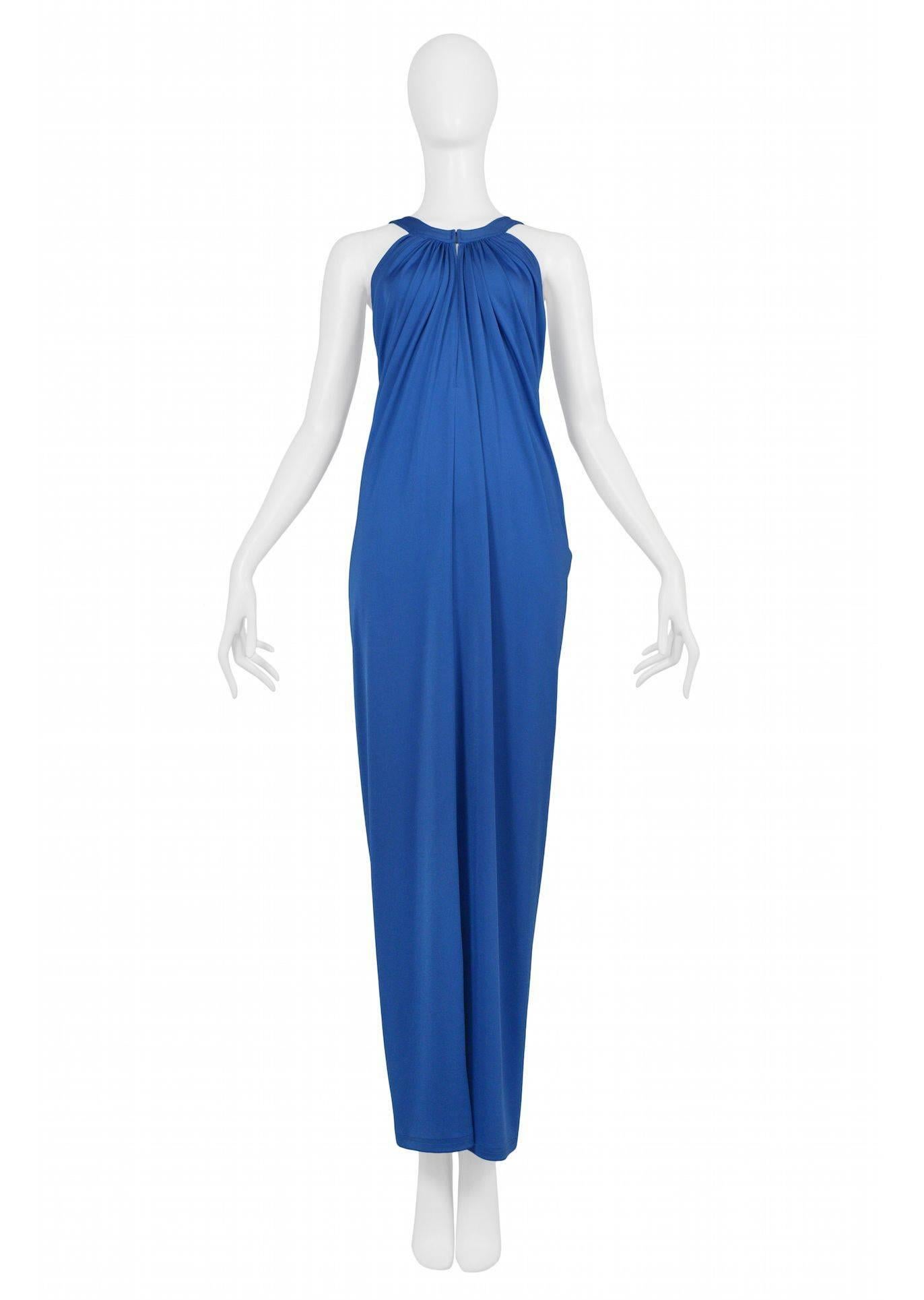 Vintage Yuki of London cobalt blue jersey evening gown with halter neckline, hook and eye closure at front, and heavy draping at back.

Excellent Vintage Condition.