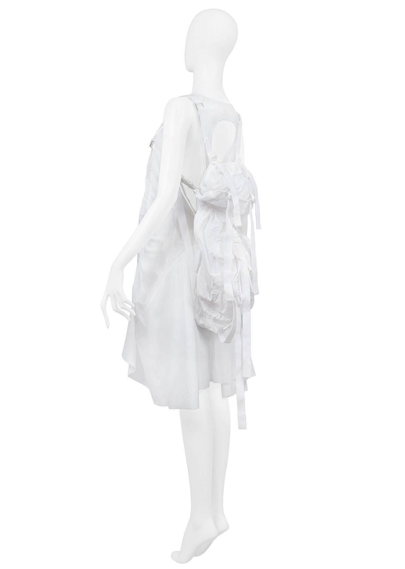 Resurrection Vintage is excited to offer an important vintage, Junya Watanabe, for Comme des Garcons white cotton parachute backpack dress. The dress features white parachute straps that adjust the dress's length, a scoop neckline, a keyhole open