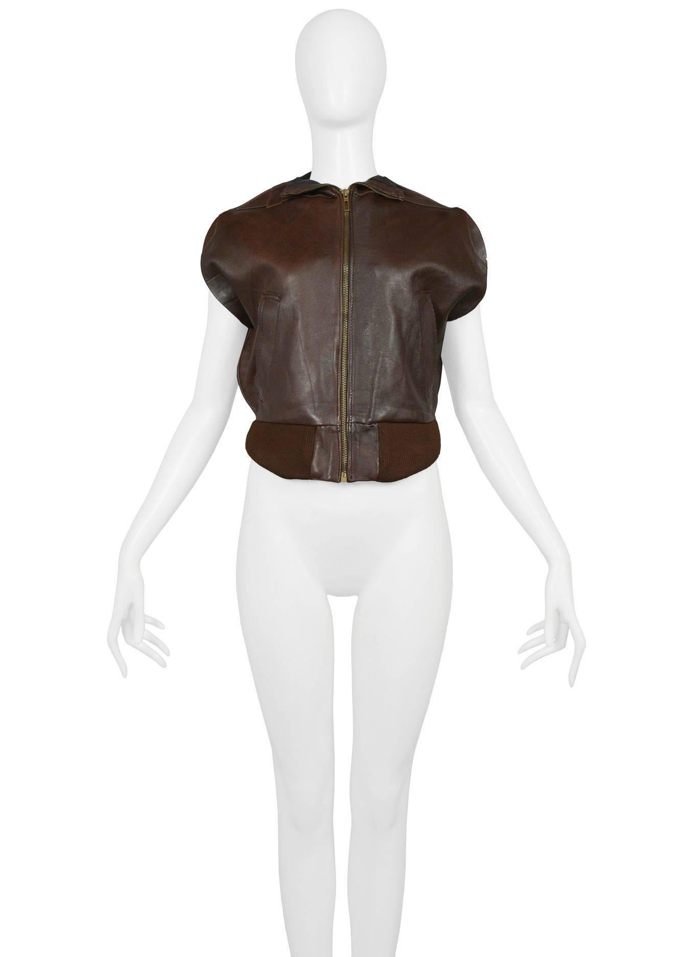 Vintage Martin Margiela artisanal brown leather zipper front circle vest made from vintage Member's Only jackets and features rib trim at the chest pocket, side pockets and waistband. Circa Spring / Summer 2002. The iconic circle vests and jackets