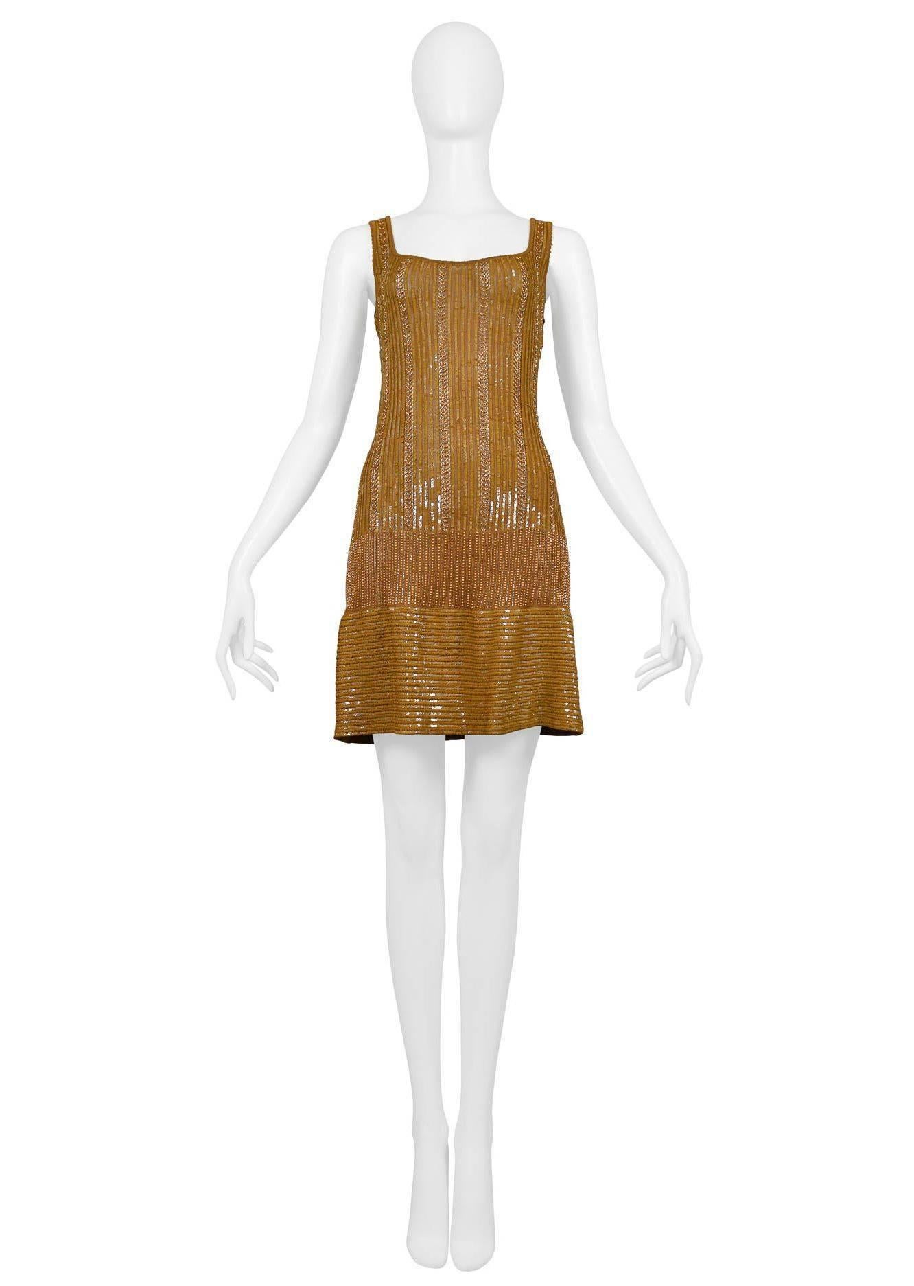 Rare vintage Azzedine Alaia gold beaded body con cocktail dress. Classic fitted knit body covered in gold beads, low square neckline, and beaded straps that will cover undergarments. Dress has clean unobstructed waistline and flat panel at skirt.