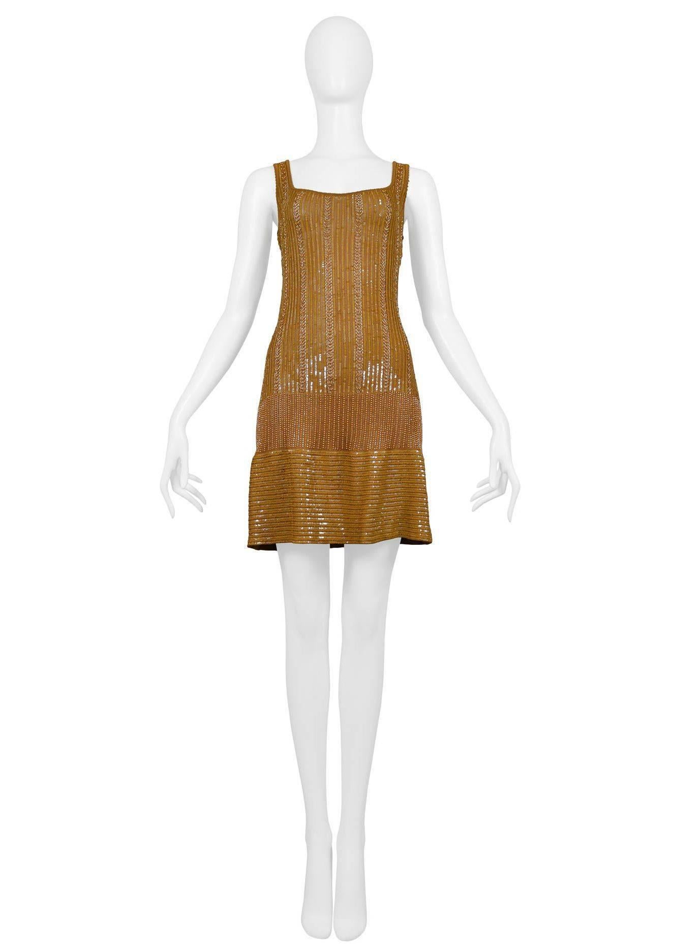 Rare vintage Azzedine Alaia gold beaded body con cocktail dress. Classic fitted knit body covered in gold beads, low square neckline, and beaded straps that will cover undergarments. Dress has clean unobstructed waistline and flat panel at skirt.