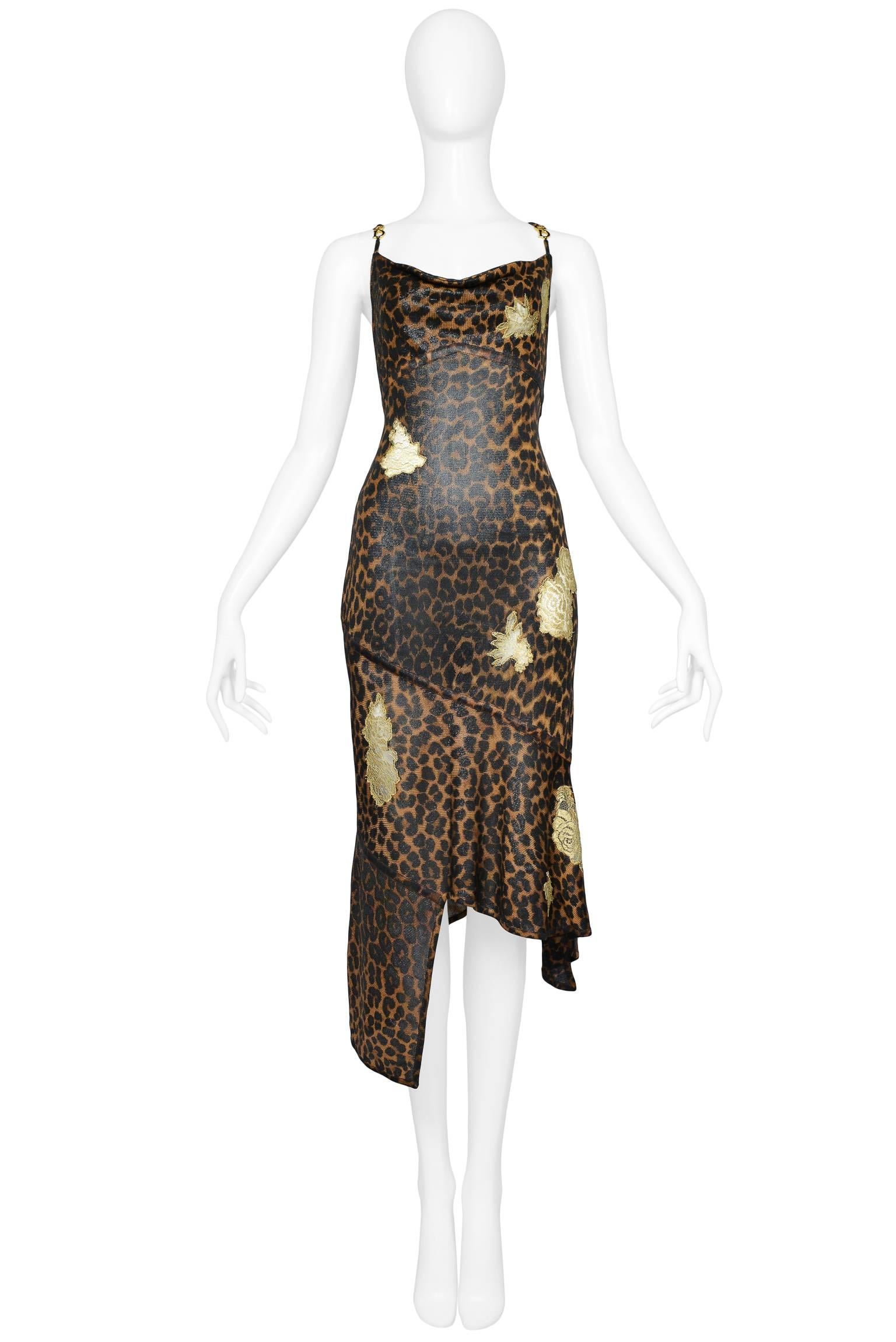 A fabulous Dior by John Galliano metallic leopard print knit body-con dress with gold tone "CD" charms at straps, gold floral lace appliques throughout, fitted bodice, and asymmetrical bandage hem. Collection AW 2000. 
