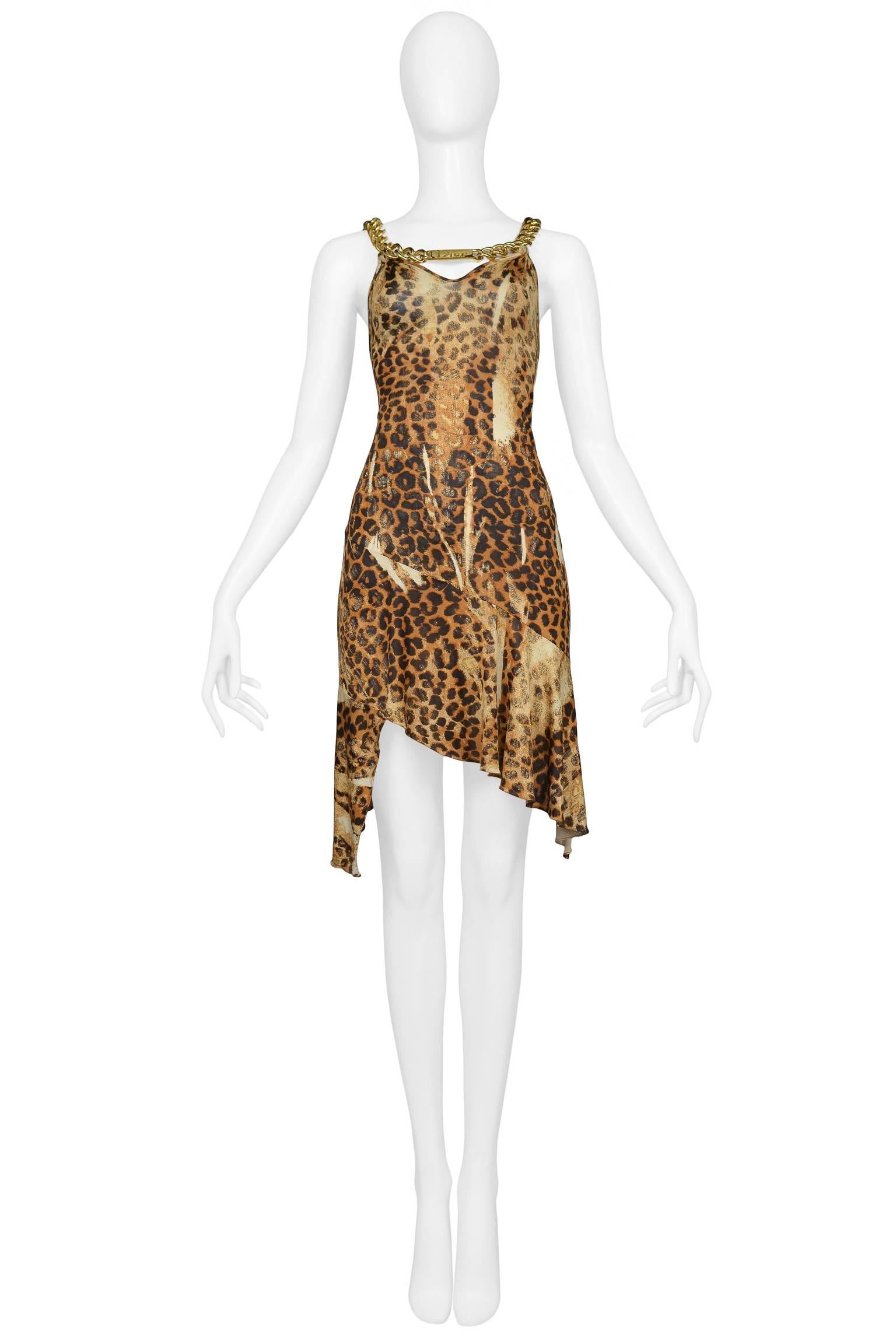 Iconic Christian Dior by John Galliano leopard print dress with gold tone oversized chunky chain necklace and straps, and DIOR ID charm. Plunging open back, keyhole front, and asymmetrical hem. Dress was featured on the runways and in advertising.