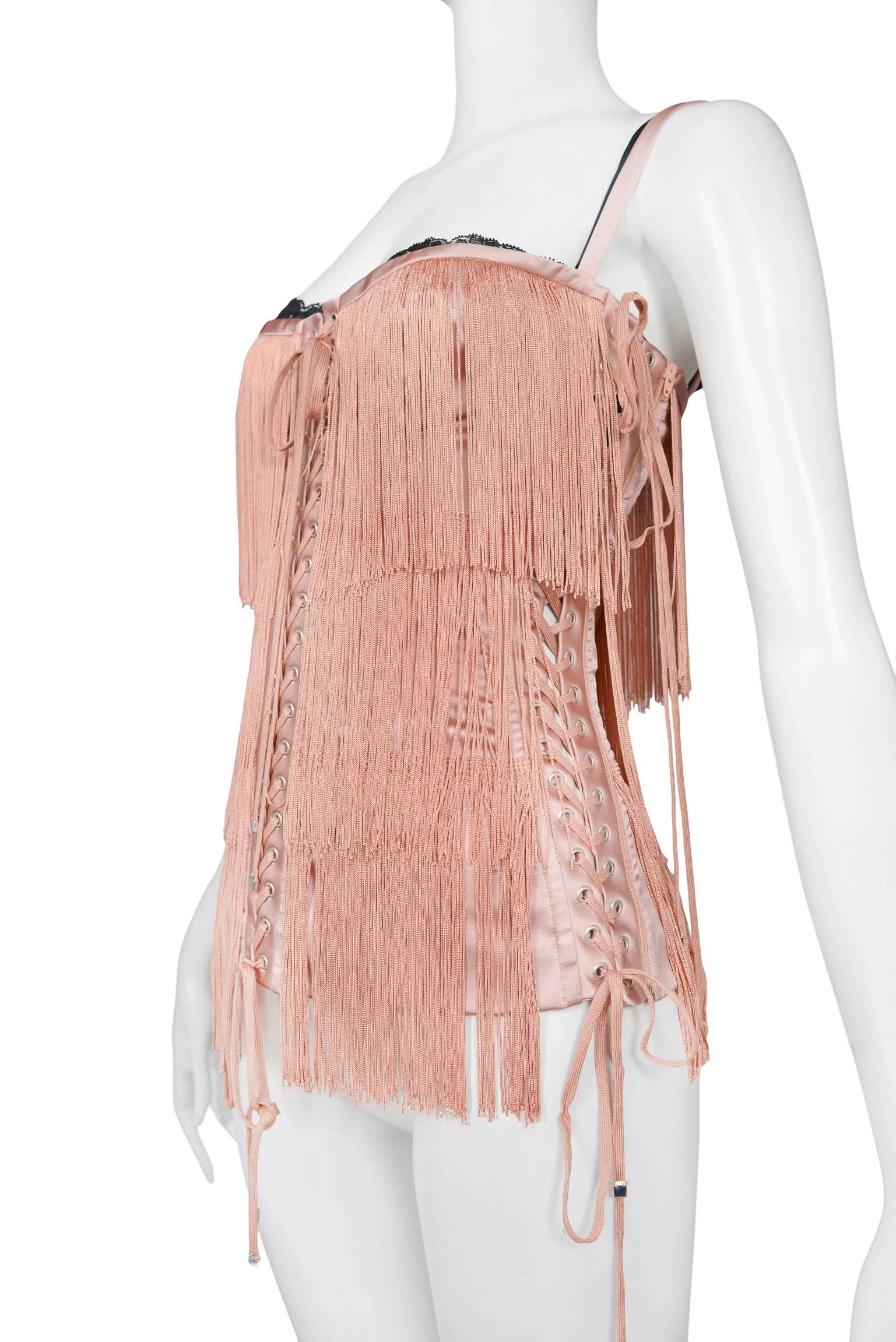Dolce & Gabbana pink blush heavy fringe corset bustier top with pink and black straps, and black lace trim. Corset bands feature pink satin and the pink laces are finished with silver tone caps at the end of each lace. Collection 2003 and featured