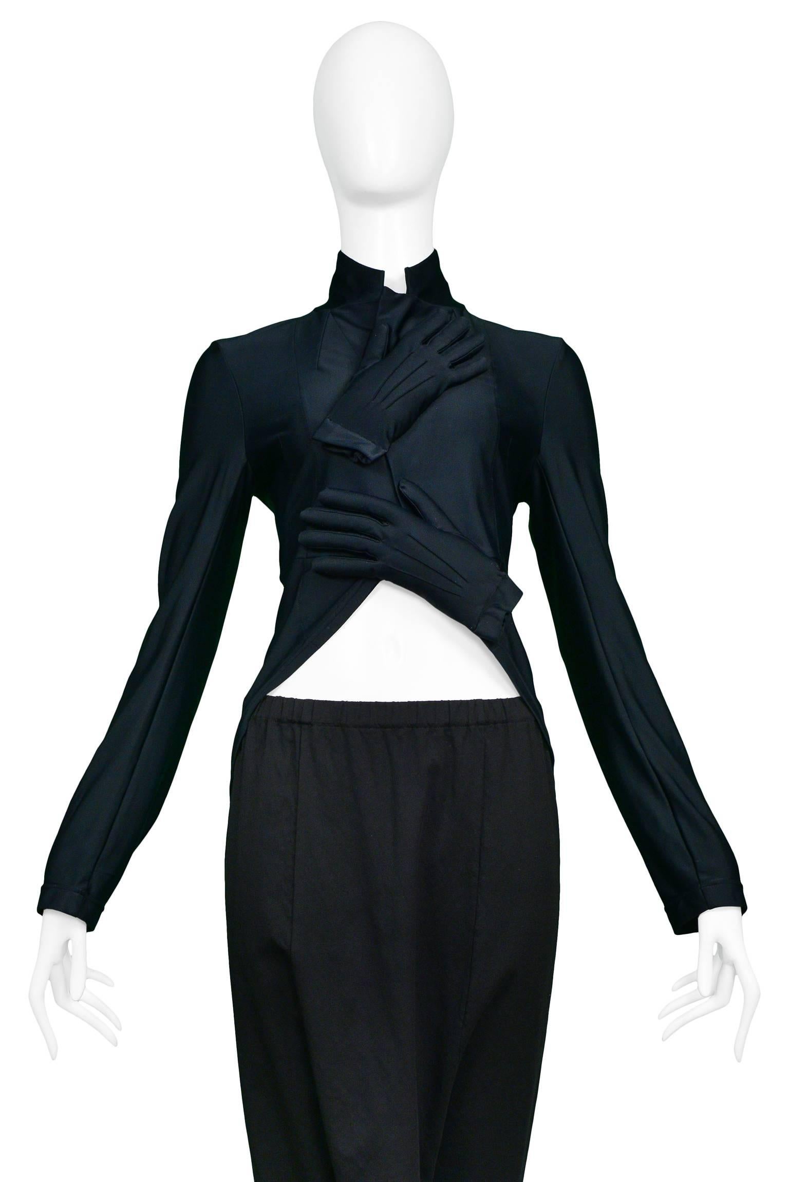 Vintage Comme des Garcons ensemble featuring an iconic black spandex padded glove top and matching black wool harem pants.
