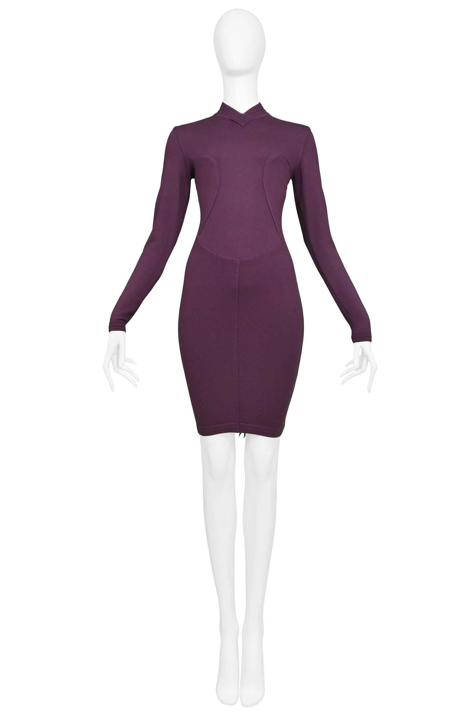 Resurrection Vintage is excited to offer a vintage Azzedine Alaia purple long sleeve body-con dress featuring a high collar neck, curved seams on the bodice, a fitted skirt and a center back zipper. 

Alaia Label
Size Medium
Measurements: (flat