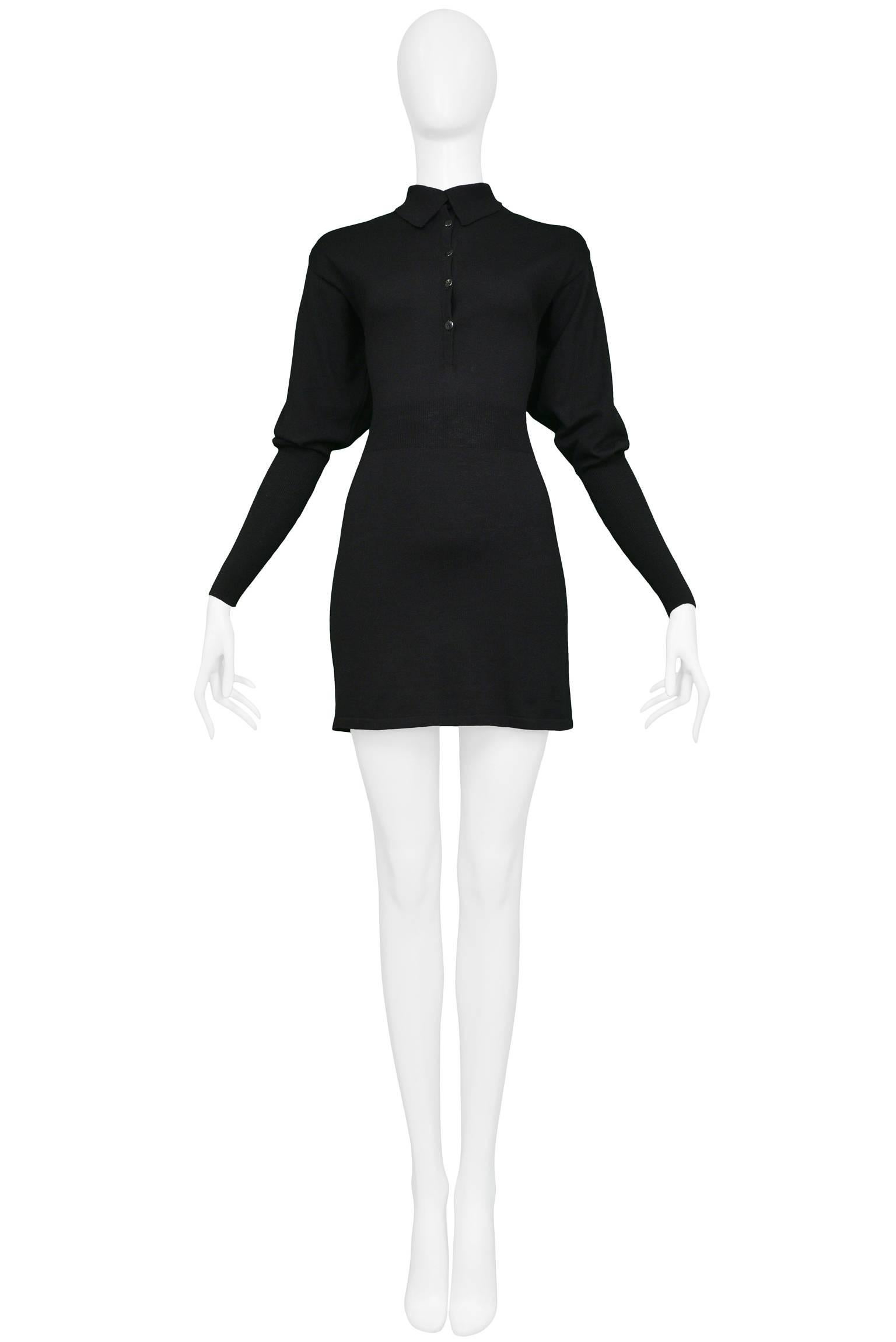Vintage Azzedine Alaia black wool knit dress. Featuring blouson sleeves and buttons ascending down from the collar. This dress has knit ribbing to cinch in the waist. 