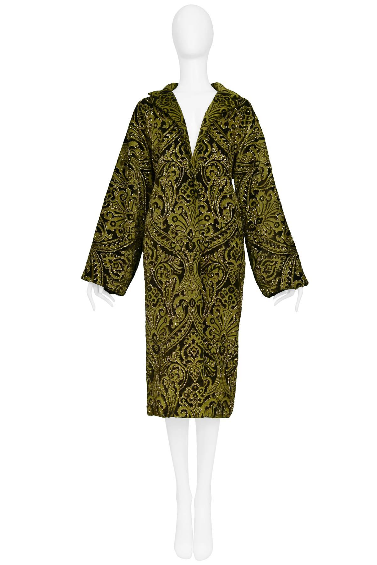 We are excited to offer a vintage Dolce & Gabbana two-tone olive green baroque velvet opera coat featuring intricate gold beading, side pockets, satin lining, and hook & eye closure. 

Dolce & Gabbana
Size 40
Measurements: Shoulder 22