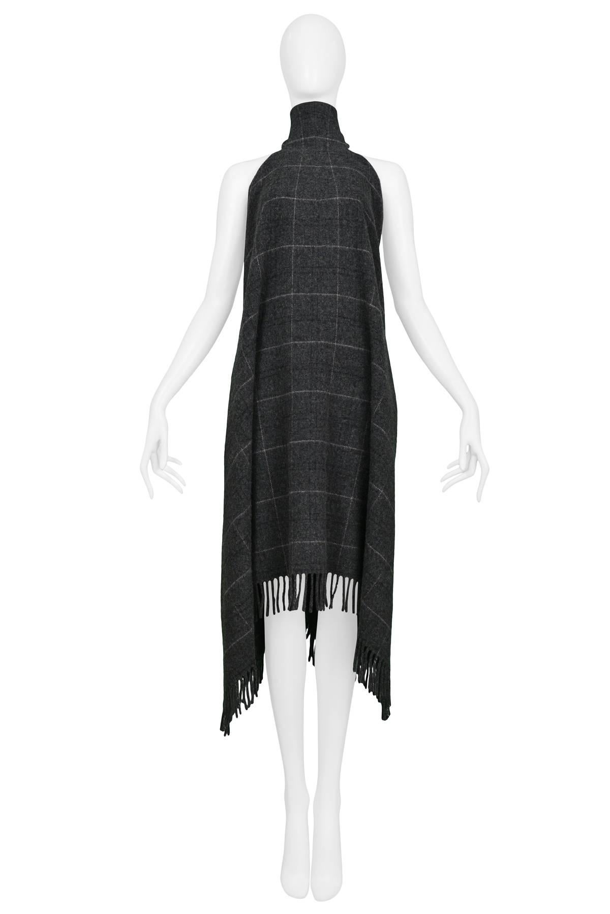 Vintage grey plaid wool Alexander McQueen blanket halter dress with fringe hem. Three buttons at neck and open back. Circa 1990's. Black and gold label. 