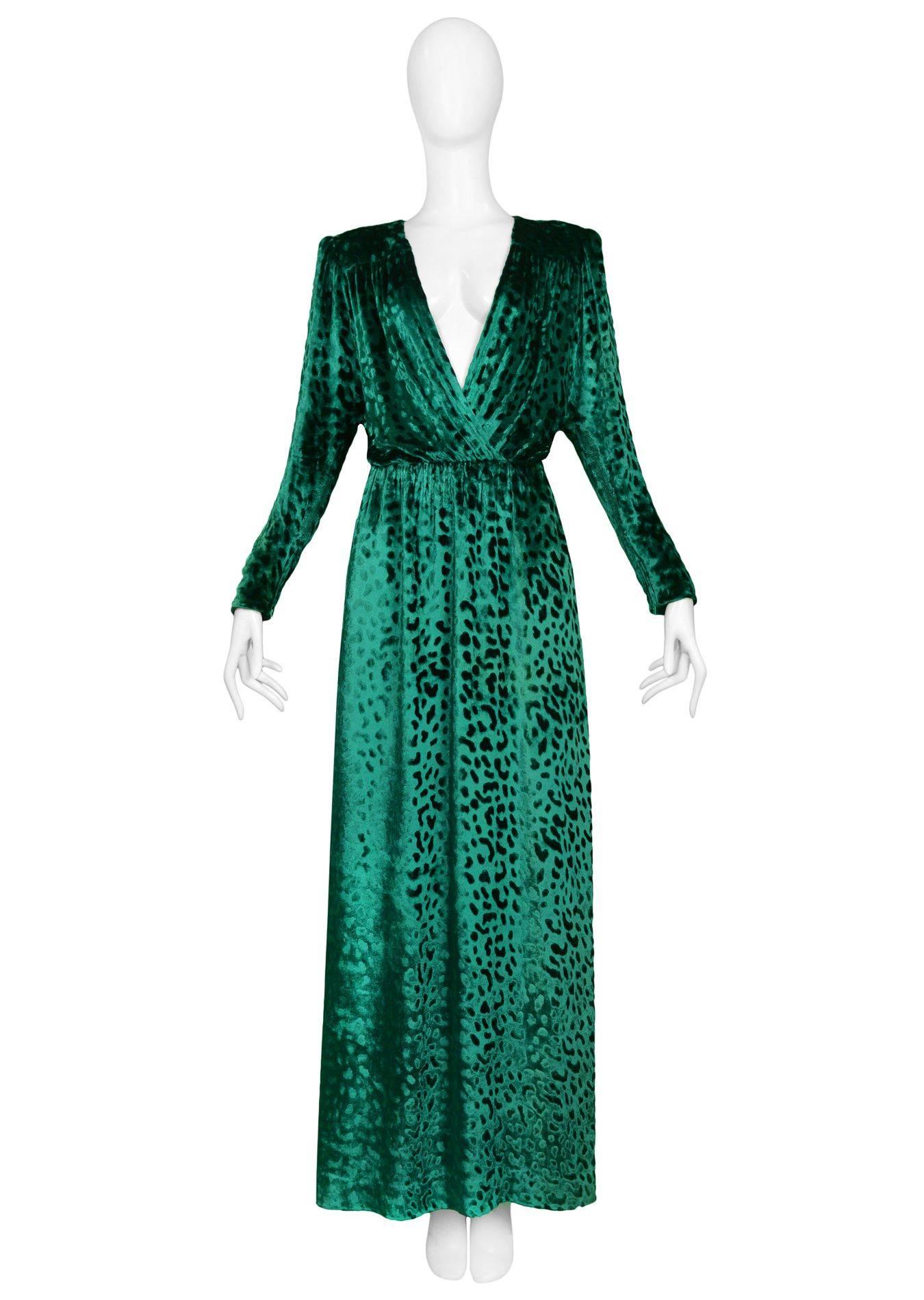 One of Yves Saint Laurent's most famous gowns as seen on Catherine Deneuve. Emerald green Yves Saint Laurent leopard velvet low cut evening gown with long sleeves and zip cuffs. Often imitated but never equalled. A must have for the YSL collector.