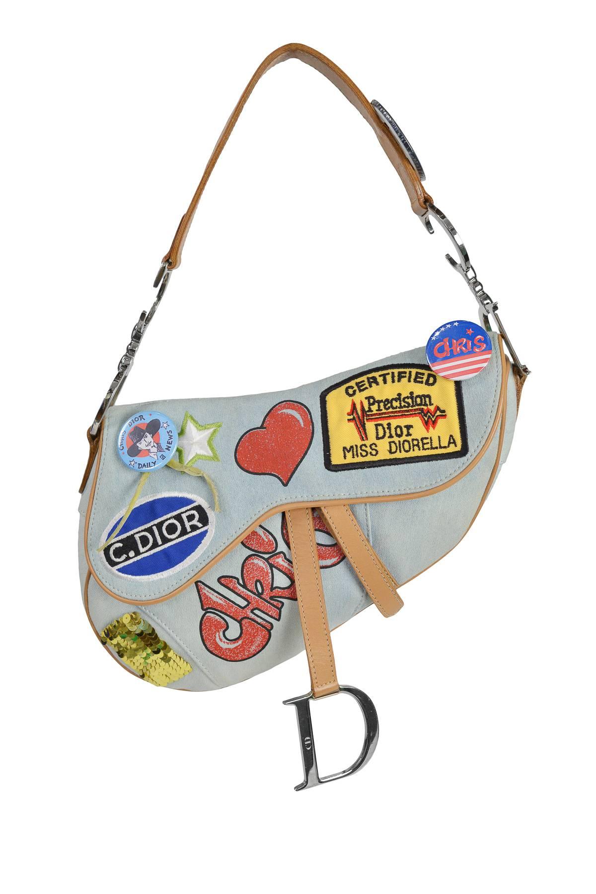 Iconic John Galliano for Christian Dior light denim 'Speedway' Saddle bag with decorative pins, patches & graffiti detail. Limited edition.

