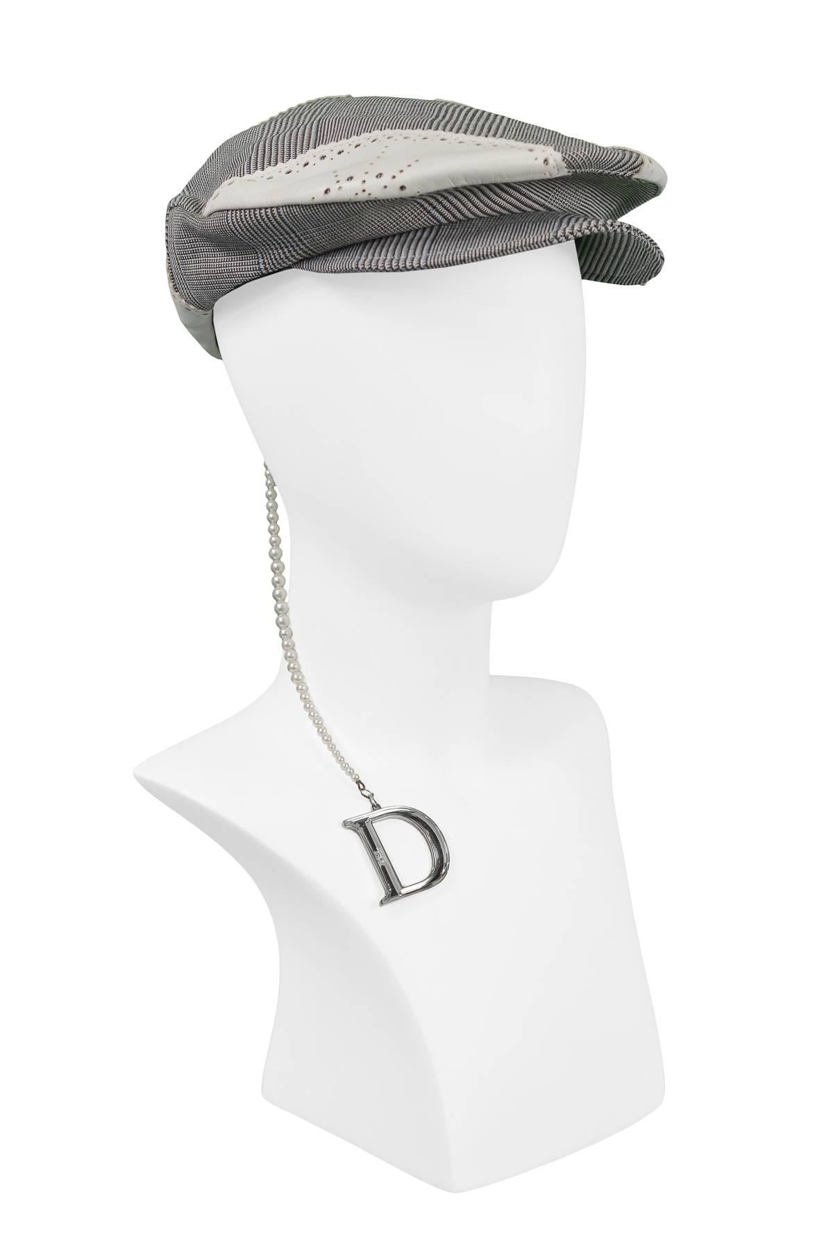 Christian Dior by John Galliano black & white check newsboy cap with laser cut white leather insets & long pearl strand with mirrored 