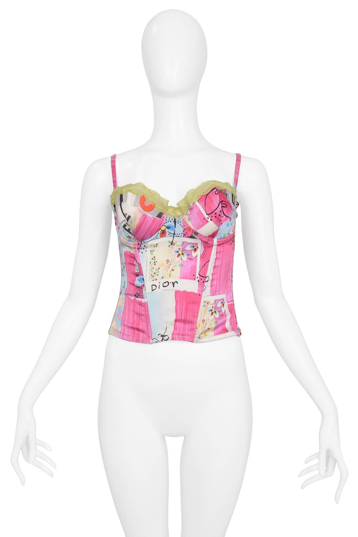 Christian Dior by John Galliano silk bustier with iconic 'Filth' print & chartruese lace detail. This piece features removable straps for a strapless option. Spring/Summer 2003 Collection.

Excellent Condition.

Size: 34