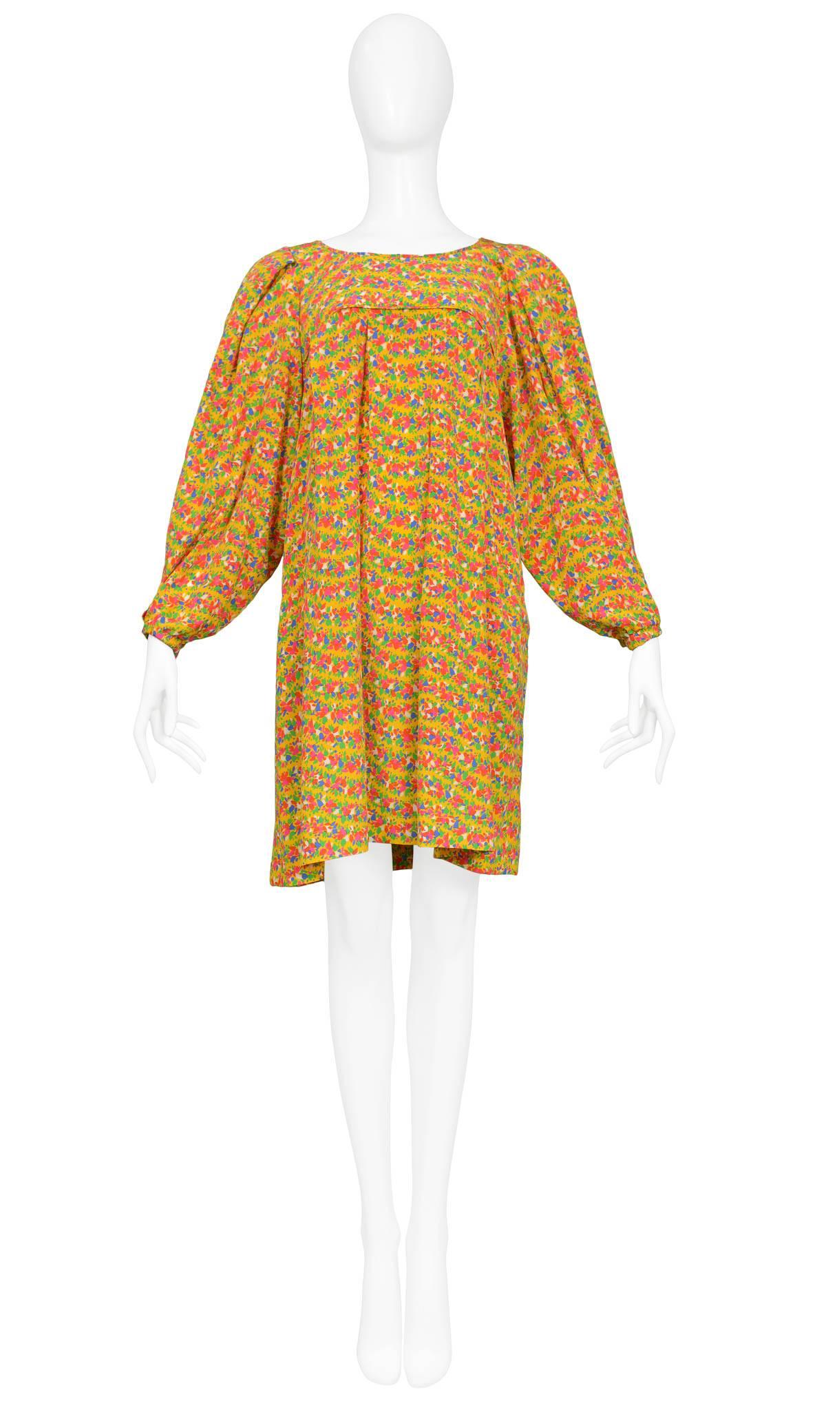Vintage Yves Saint Laurent knee-length yellow silk floral smock mini dress with blouson sleeves. Circa 1970s.

Excellent Condition.

Size: Small