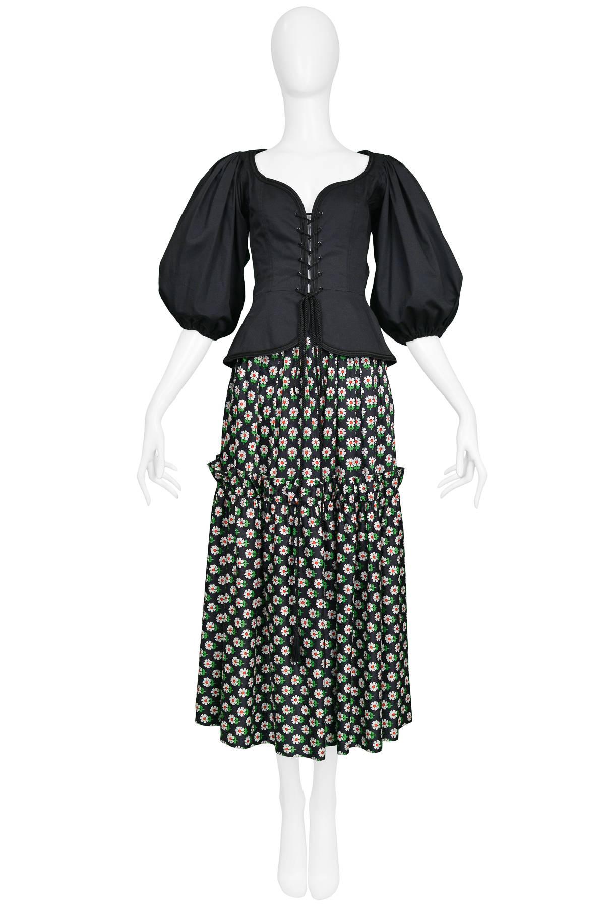 Yves Saint Laurent Peasant Ensemble featuring a black cotton tassel corset blouse from the Spring/Summer 1977 Russian Collection & daisy-print ink blue cotton peasant skirt.

Excellent Condition.

Size: 36 Skirt, 36 Top
