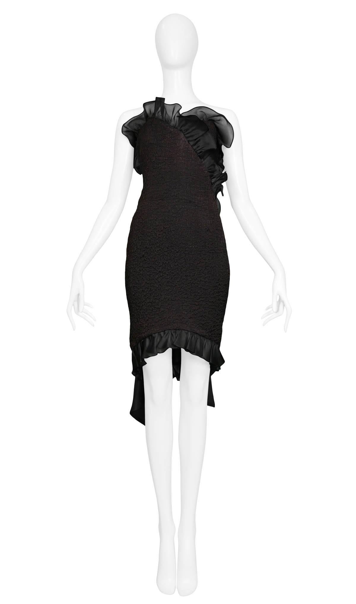 Vintage black textured silk strapless cocktail dress with ruffles along the sweetheart neckline & hemline. The dress features large silk bow detail at back. From the1987 Spring/Summer Collection. 

Excellent Condition.

Size: 38