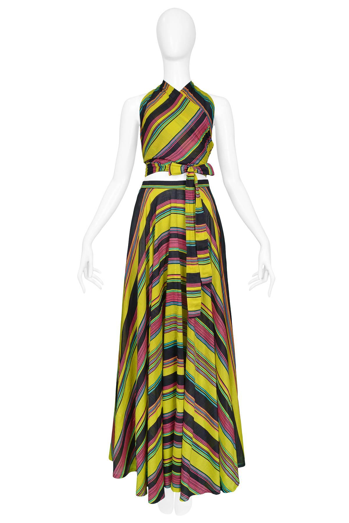 Resurrection Vintage is excited to offer a vintage 1970s Yves Saint Laurent chartreuse wrap top & skirt ensemble with multi-color stripes. The top features a wrap-around front tie closure and an open back. 

Yves Saint Laurent
Size