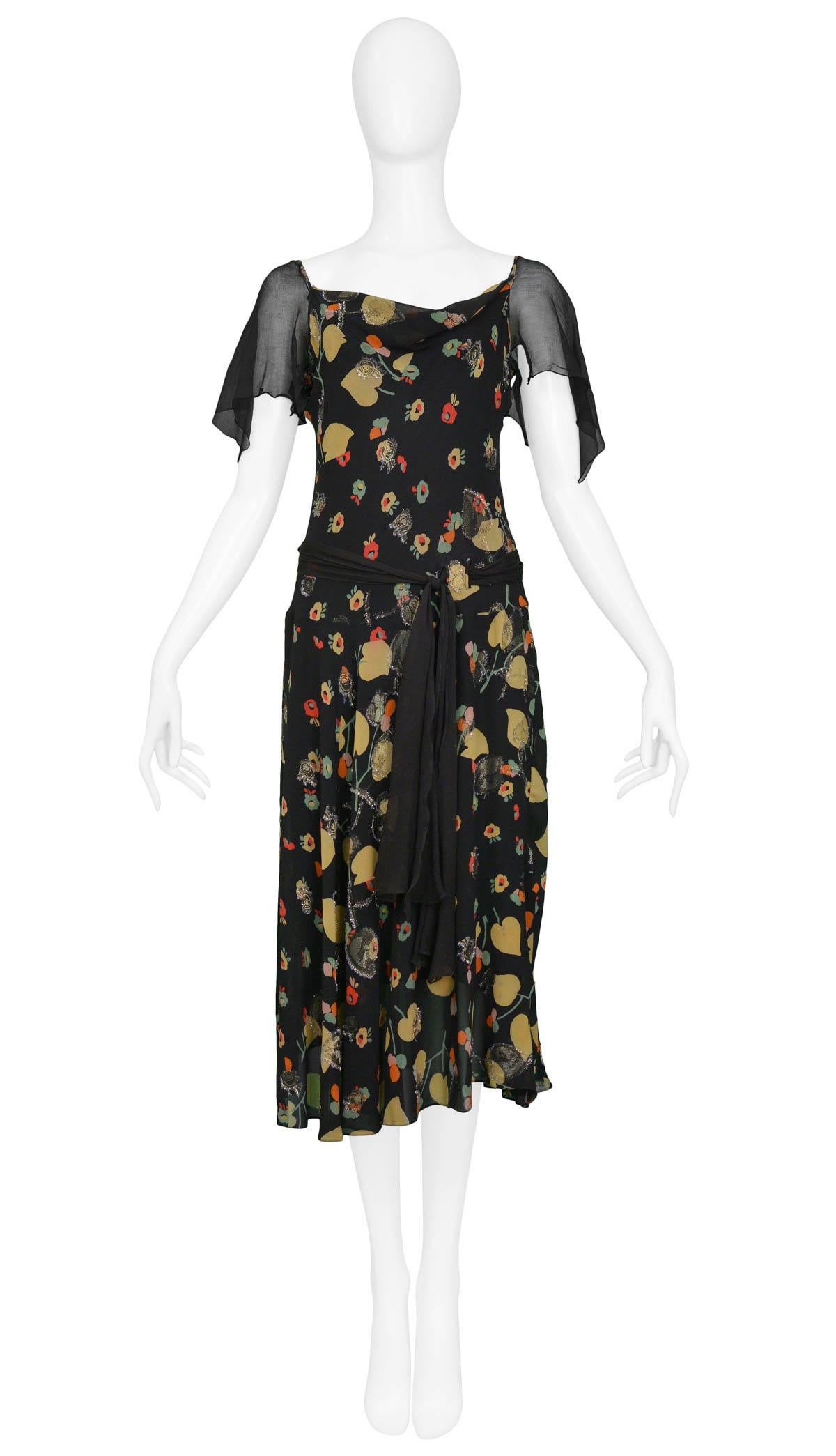 Vintage Chanel black chiffon and floral 1930s inspired tea dress with flutter sleeves, waist sash & gold lurex threading throughout. 

Excellent Condition.

Size: 2/4