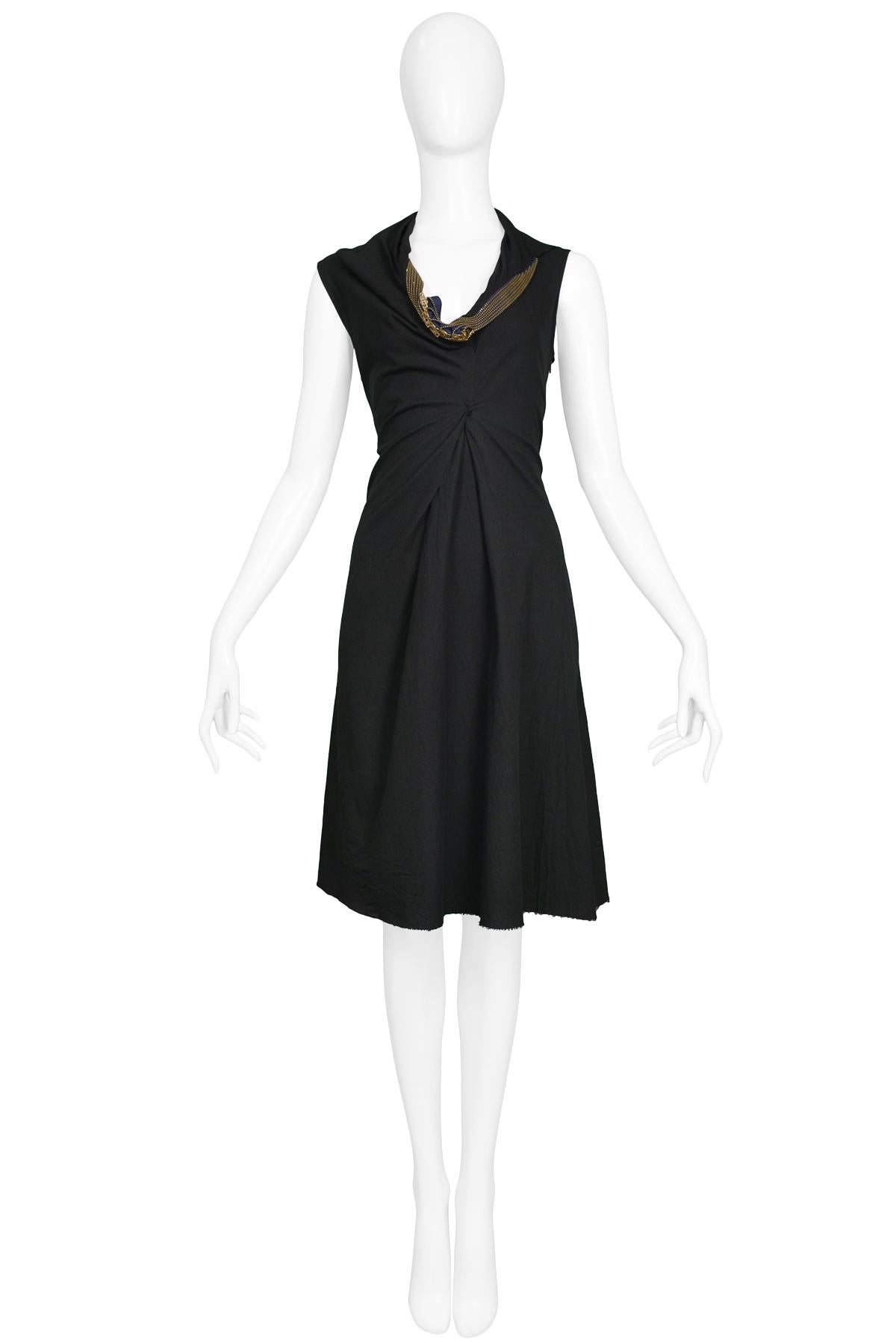 Resurrection Vintage is excited to offer a vintage Junya Watanabe black cotton sleeveless knee-length dress featuring multiple brass zippers encircling the collar. 

Junya Watanabe
Size: Small
Measurements: Bust 34