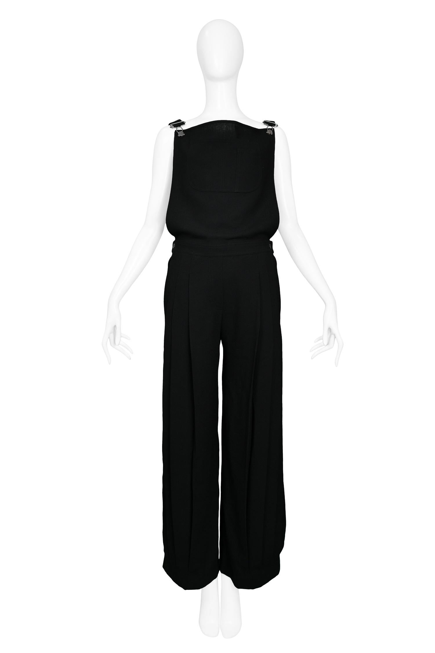 Vintage John Galliano for Christian Dior black wool crepe overalls featuring pleated wide leg pants & front pocket detail. Featured on the Spring/Summer 1999 Runway.

New with Tags; Never Been Worn.

Size: 36