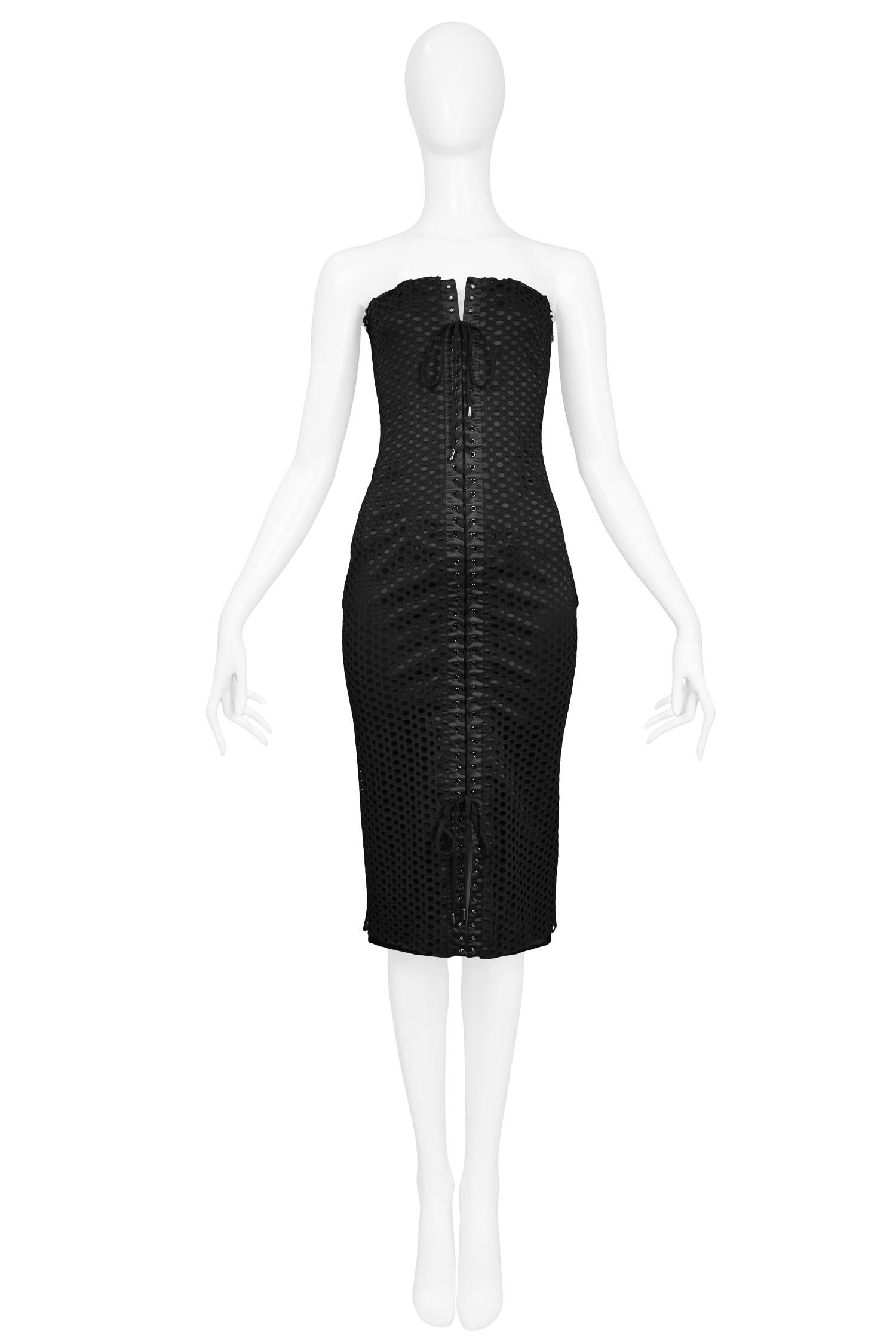 Vintage Dolce & Gabbana black strapless corset dress featuring a perforated mesh overlay and double corseting lace-up detail at the front and back of the dress.

Excellent Condition.

Size: 38