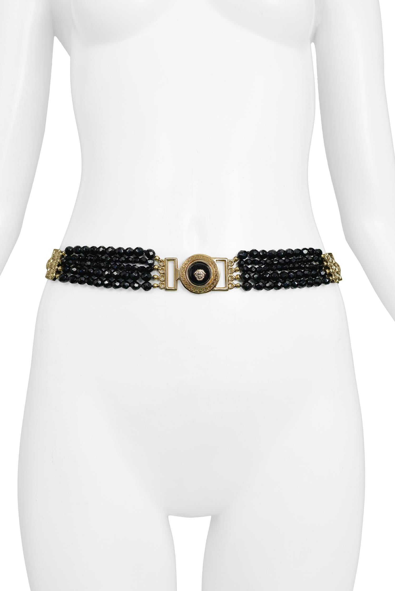 Vintage Gianni Versace black patent leather and multistrand faceted beaded belt featuring gold tone Medusa medallions. From the Autumn/Winter 1994 Collection. 

Excellent Condition. 