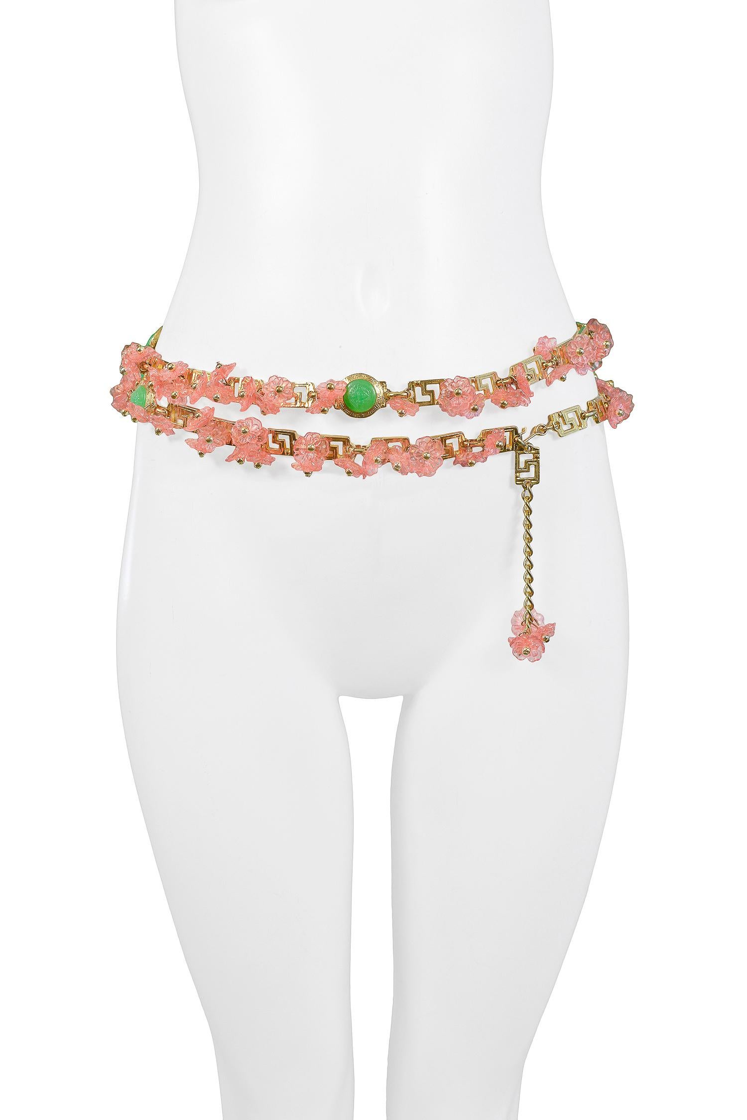Vintage Gianni Versace pink acrylic floral charm belt with gold beads, neon green Medusa medallions, and greco links. Circa, 1993.

Excellent Condition.

Size: ONE SIZE