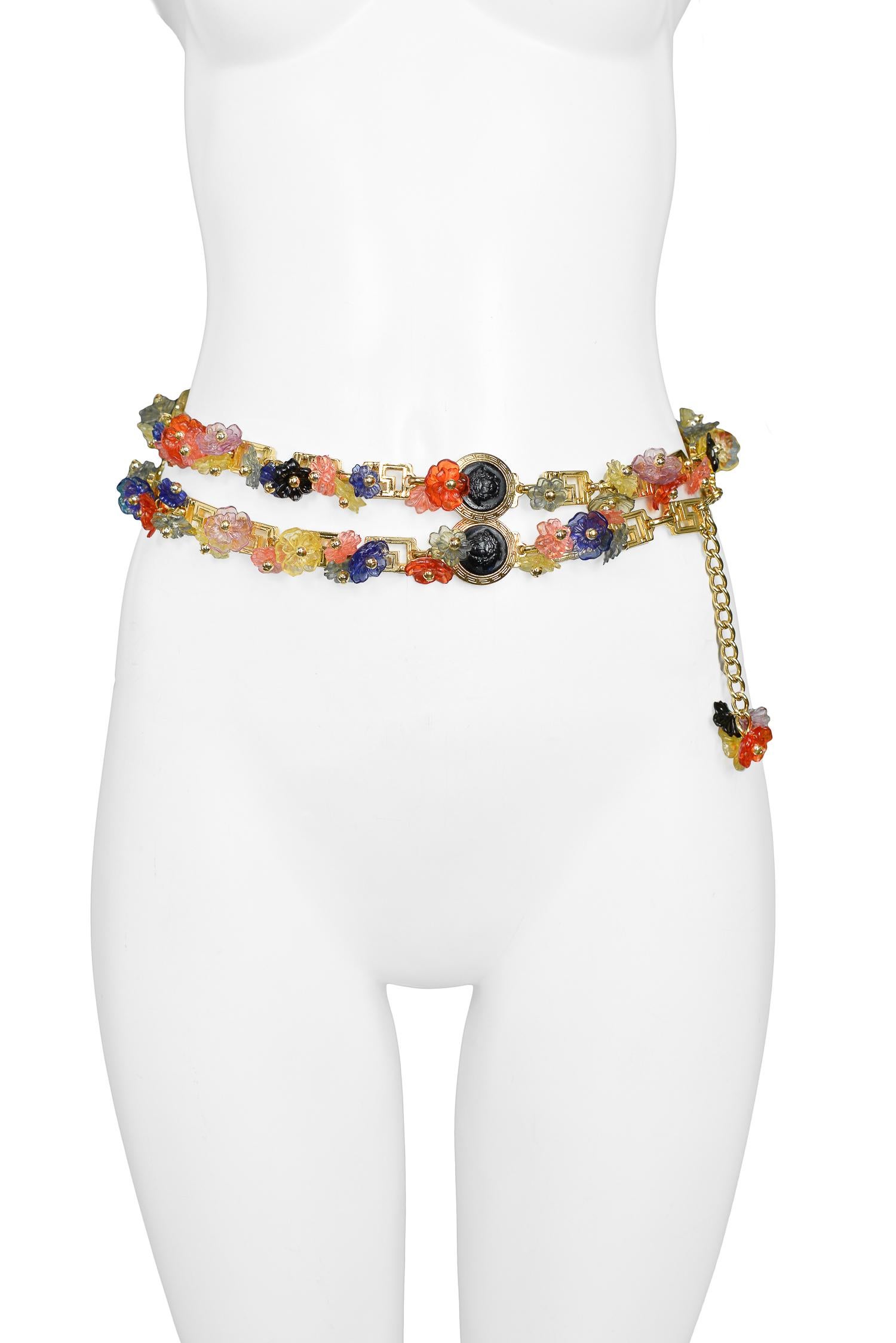 Vintage Gianni Versace multicolor acrylic floral charm belt with gold beads, black Medusa medallions, and greco links. Circa, 1993.

Excellent Condition.

Size: ONE SIZE
