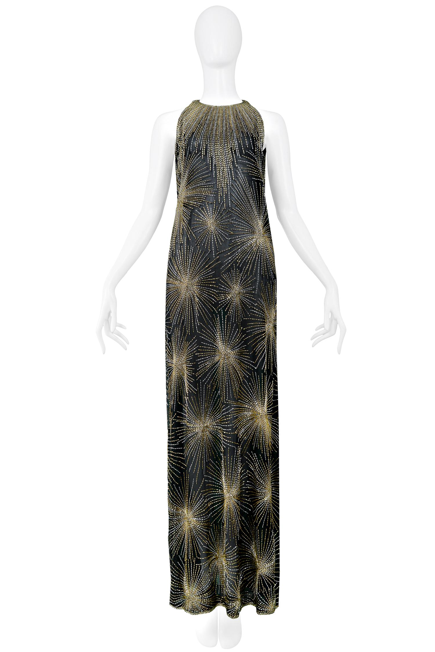 Vintage Halston black chiffon sleeveless a-line gown featuring allover gold & silver beaded firework bursts and a cascade of beads at the neckline. From the Autumn/Winter 1980 Collection.

Excellent Condition.

Size: SMALL
