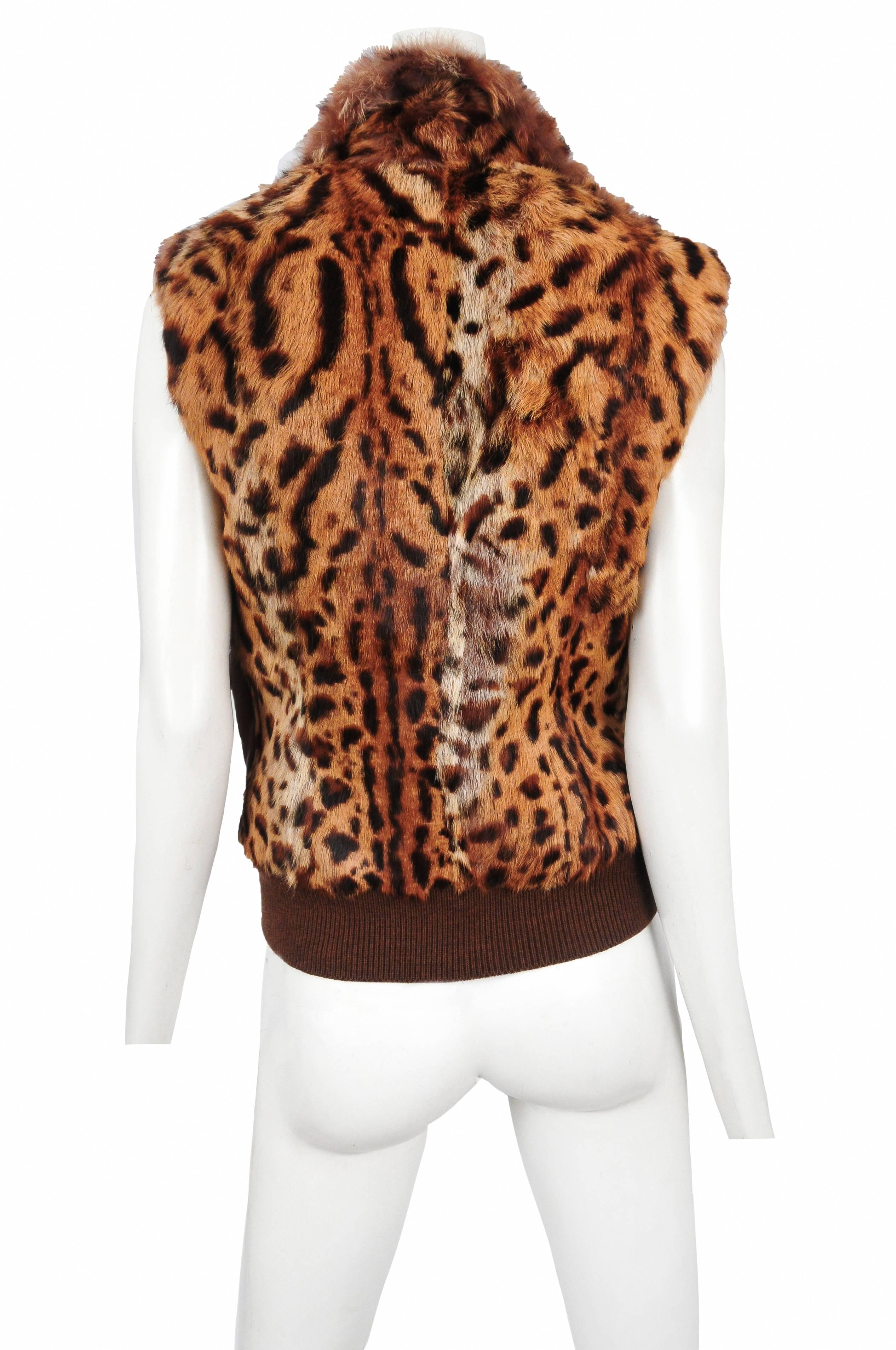 Vintage John Galliano for Christian Dior brown leather and leopard print rabbit fur vest featuring four brass buckled pockets at torso and a front zip closure.