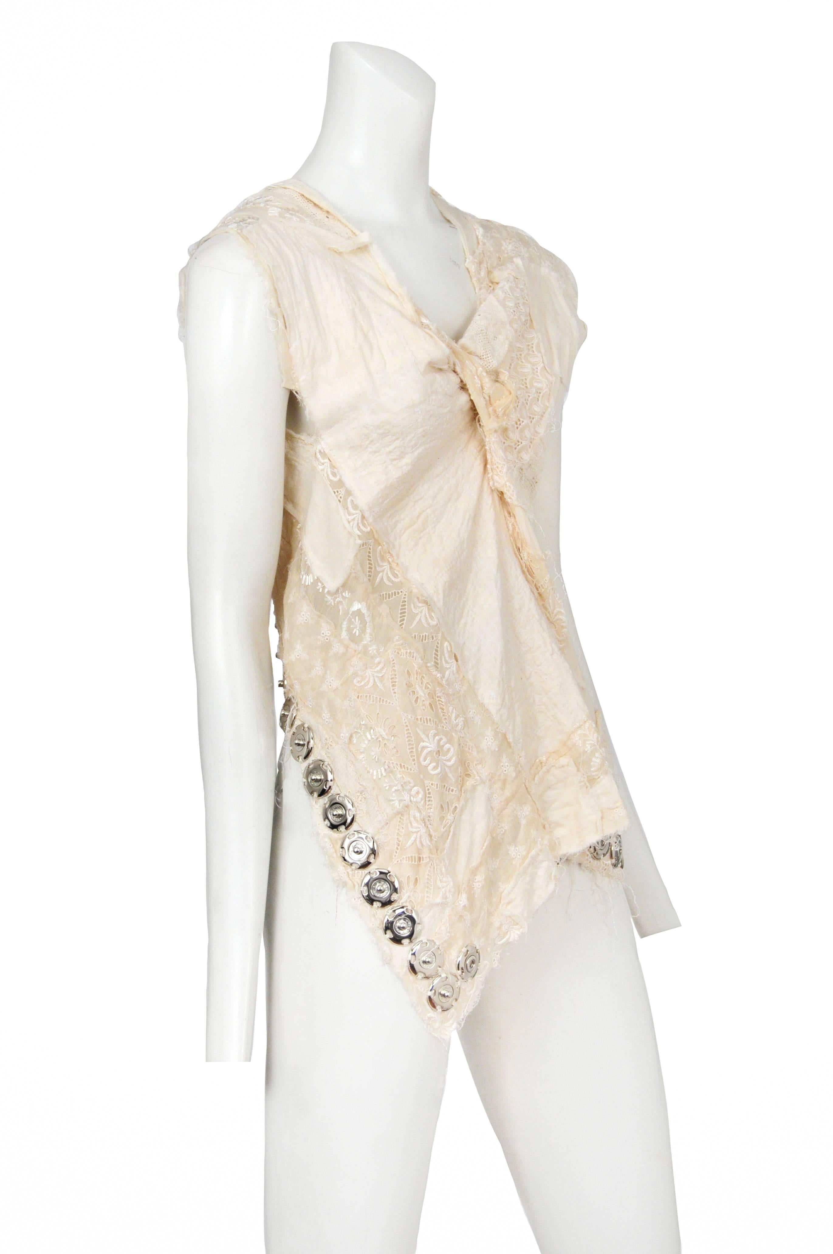Vintage Junya Watanabe cream embroidered abstract sleeveless top featuring exposed snaps along the hem. Runway piece from the Spring 2005 Collection.