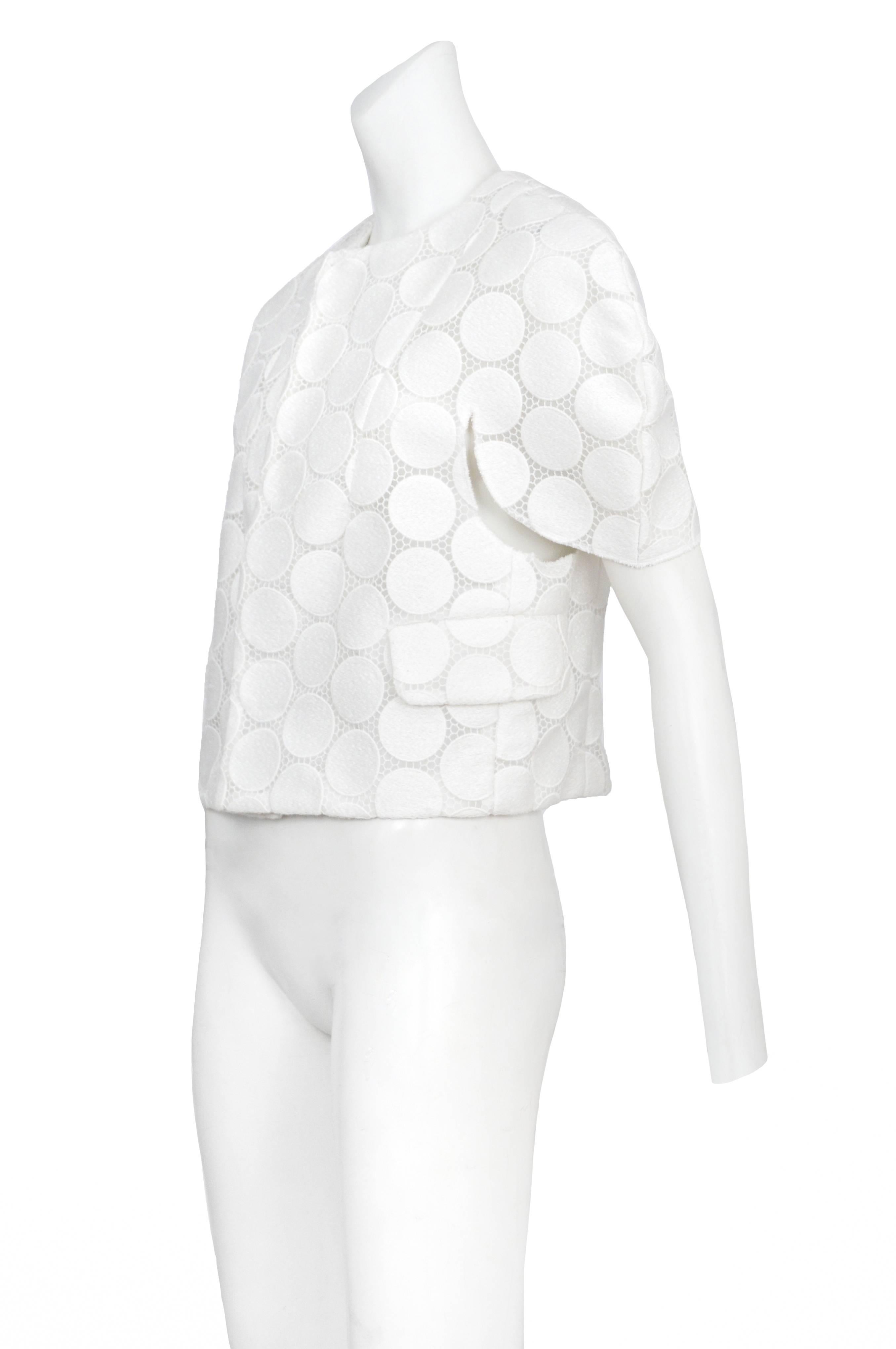 Vintage Comme des Garcons white embroidered lace polka dot short sleeve jacket featuring side pockets, front darts and cut out arm holes.