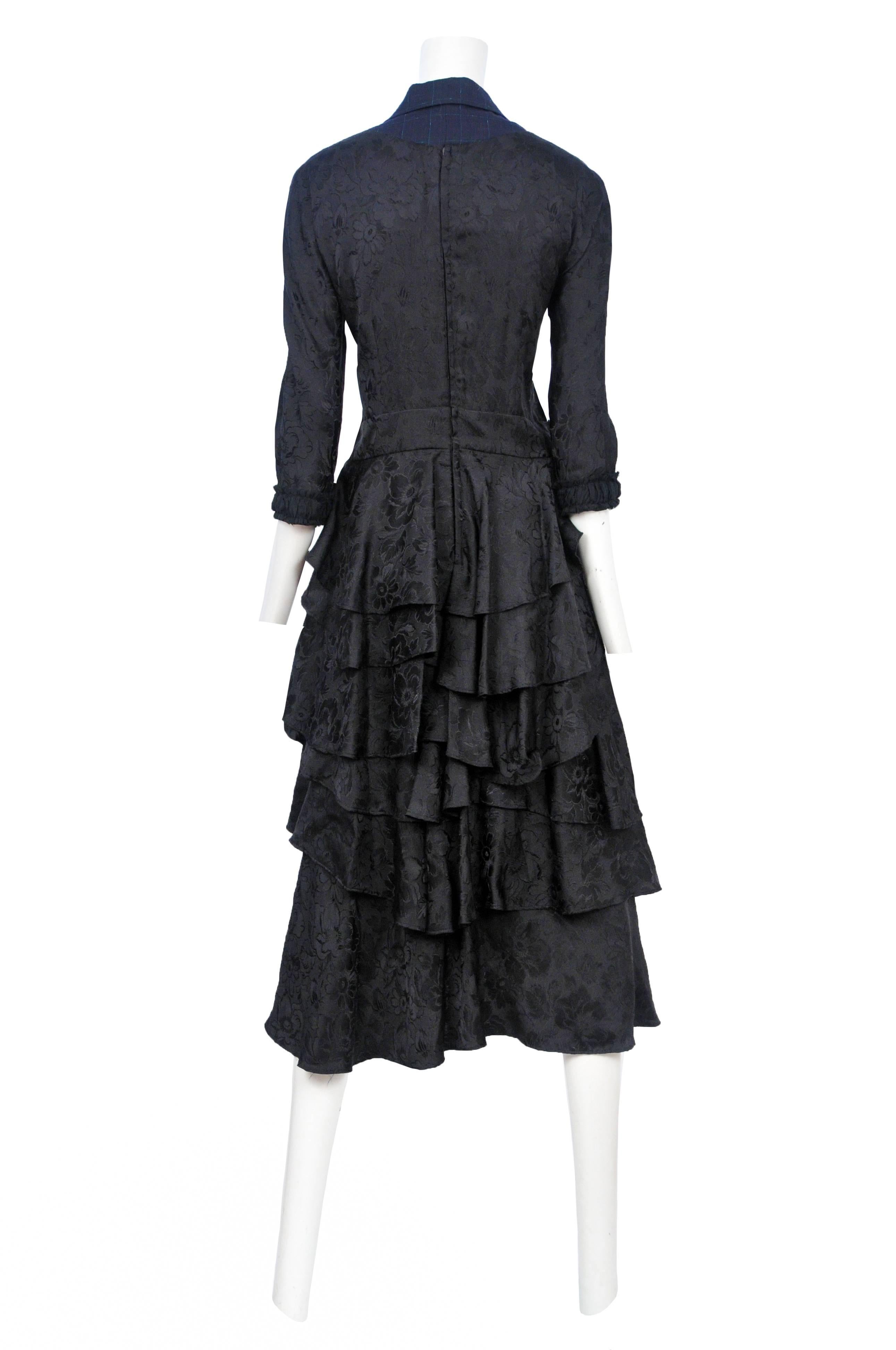 Vintage Comme des Garcons black floral damask wedding dress featuring navy pinstripe wool at the collar, tiers of gathered black ribbon at the skirt and layers of ruffles at the back skirt. Circa 2006