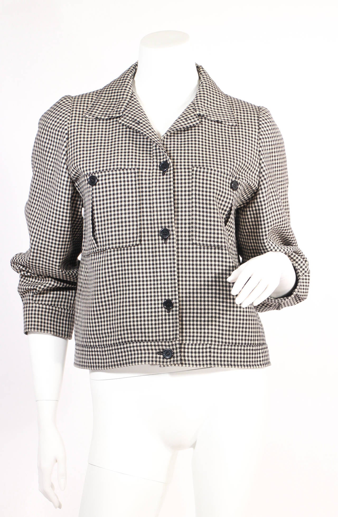 Yves Saint Laurent rive gauche black and white houndstooth jacket. Fully lined, two pockets, mint condition, super stylish 3/4 sleeves. Excellent condition. Fits US 4.

Circa 1970's- Early 1980's