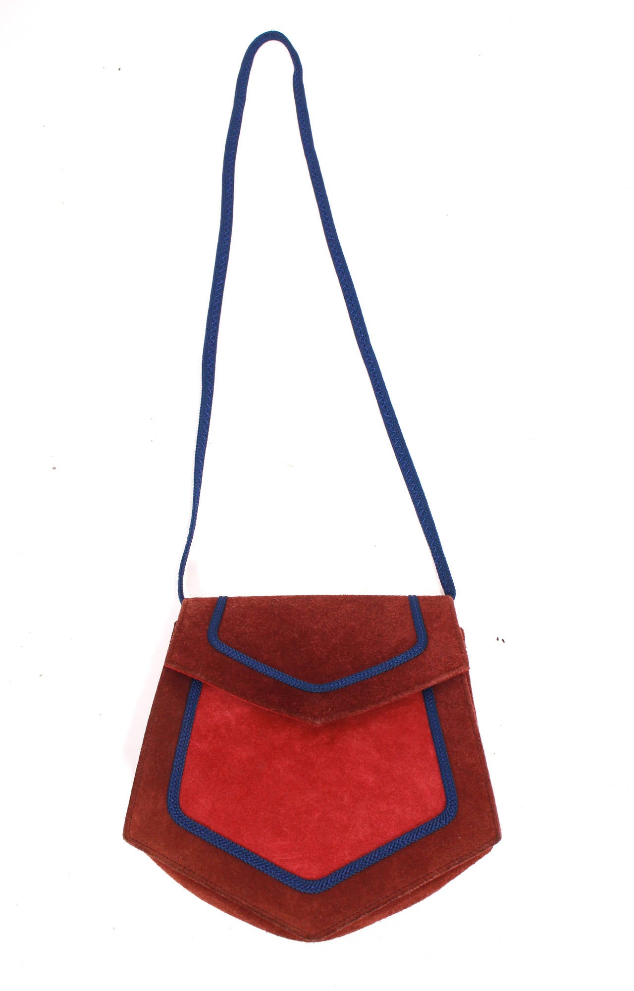 Yves Saint Laurent 1970's multi colored suede bag. Outlined in blue piping/ribbon. The perfect 70's accessory this spring!