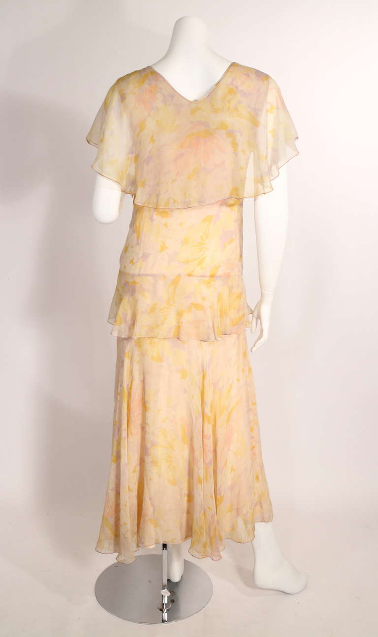 Dating back to the 1930s. This gorgeous chiffon dress is perfect for this spring and summer. Gorgeous lines and print. Comes with slip.