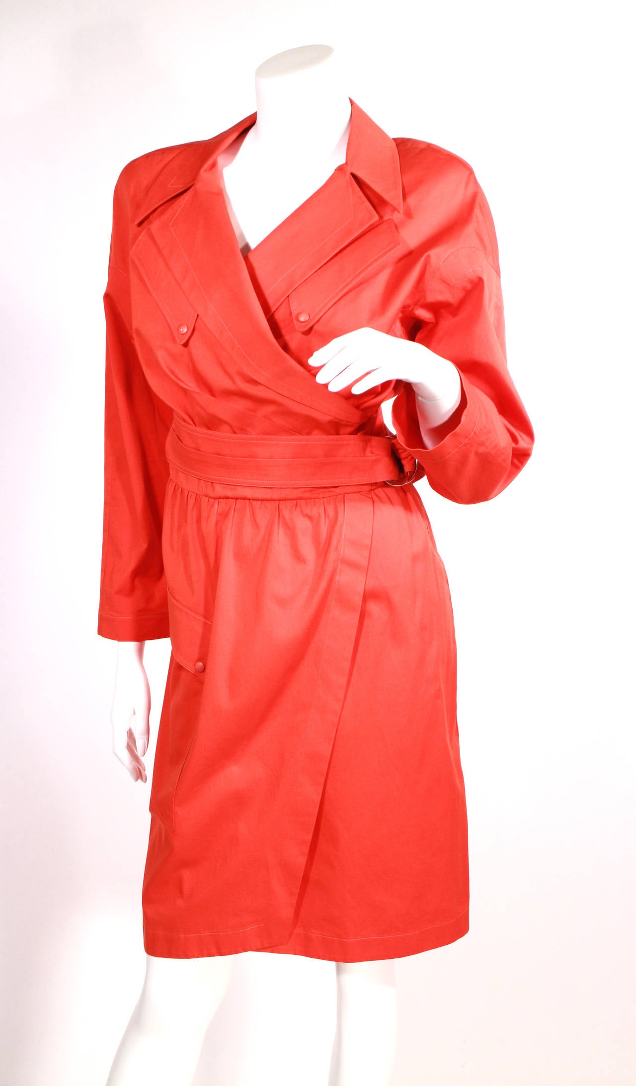 Thierry Mugler red wrap dress. Circa 1980's. Features oversized collar, belt, and shoulder pads. Excellent condition.
