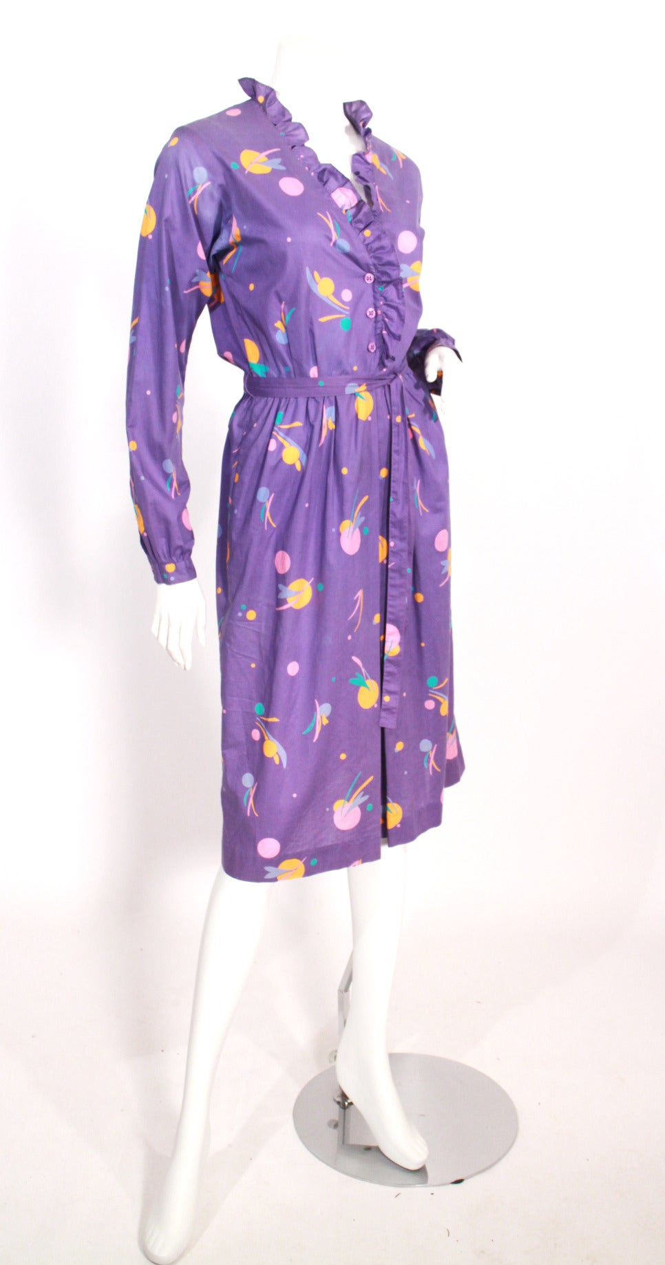 1970s/1980s Diane Von Furstenberg shirtdress. Featuring a super fun colorful print, belt at waist, and pockets. Perfect for this summer, day to night!

Arm Length: 24 in. (buttoned cuff's at wrist)