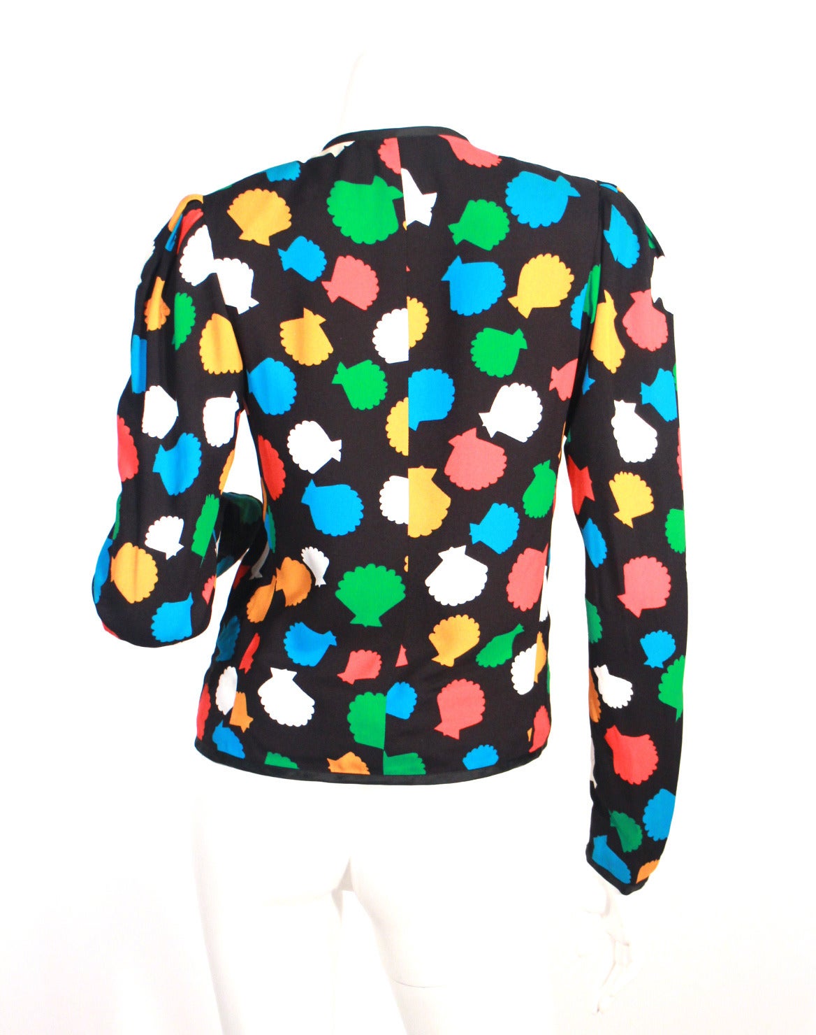 1980's Yves Saint Laurent sea shell print jacket/blouse. Can be worn as a blouse or open as a little summer jacket. Colorful fun print, lined, shoulder pads, black buttons up the front. 

Size 36, true to size
Full Length 23in
Arm Length 25in
