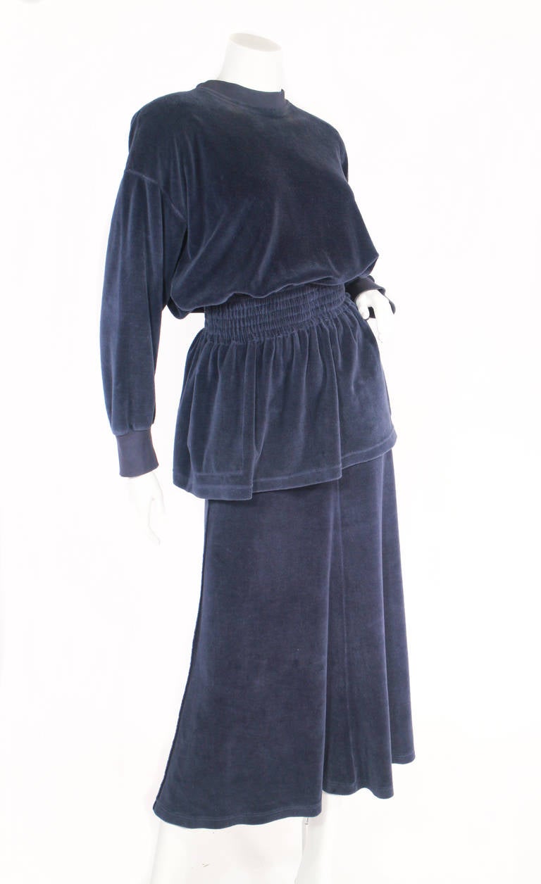 Late 1980's Sonia Rykiel velour skirt set. Shirt features an elastic cinched waist with pockets and small shoulder pads, and three button closure at he neck. The skirt has a slight flare at the bottom. Very comfortable, great Sonia piece! Fits a