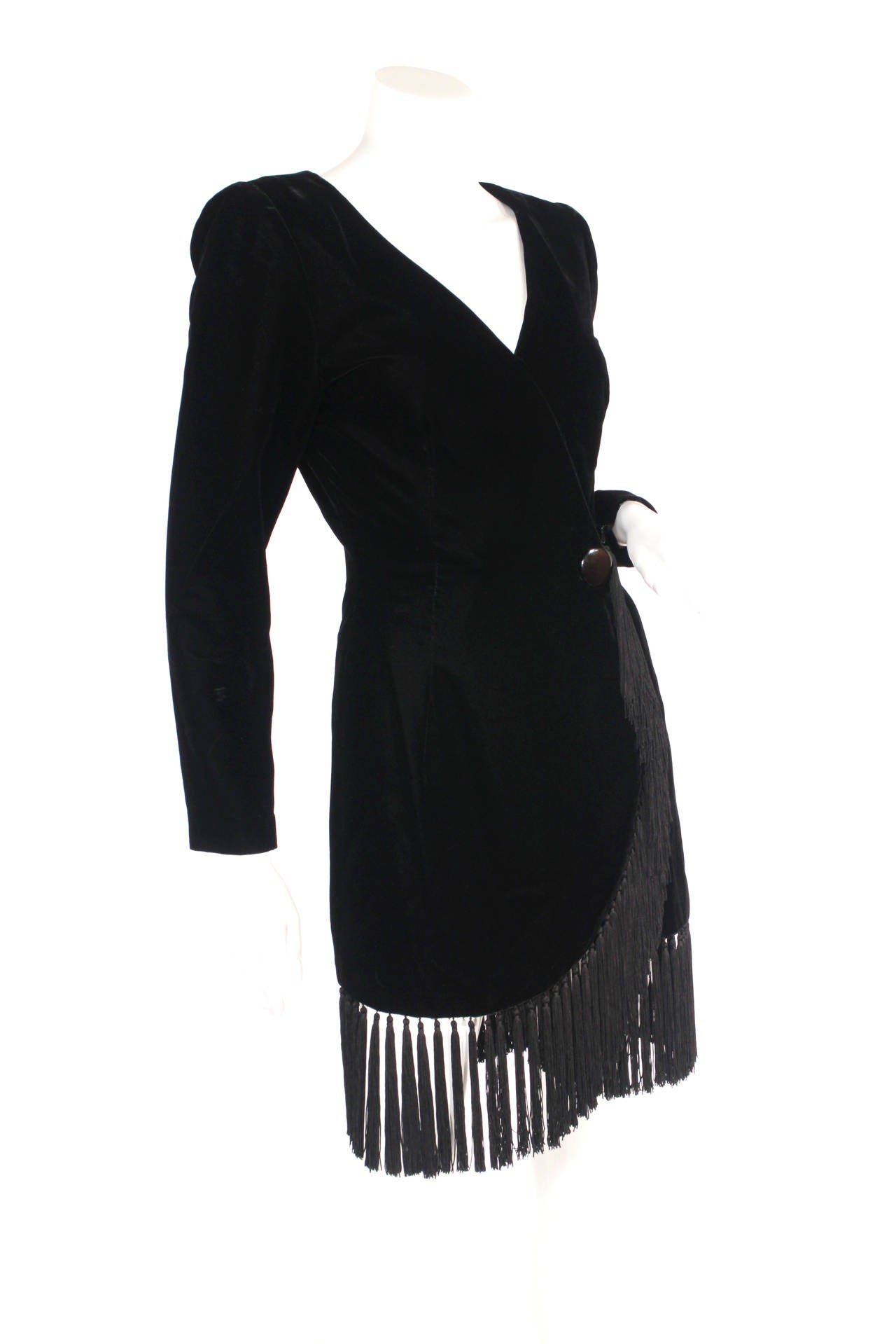 Givenchy Nouvelle Boutique black velvet fringe dress. This fringe sensation is the perfect holiday and winter dress. Features: snap closures up the front of the dress, shoulder pads (that could be taken out easily), fully lined, zip closures at the