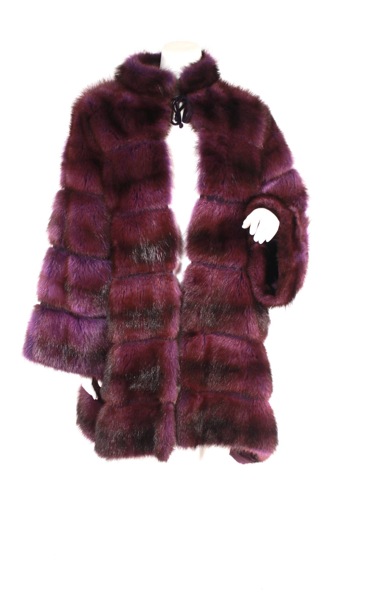 Carlo Tivioli Purple Mink Coat. Gorgeous deep purple mink, excellent condition. Tie closure at the collar. Has a nice swing quality, longer on the back sides.

Originally owned by the famed singer and night club owner Regine Zylberberg from Paris,