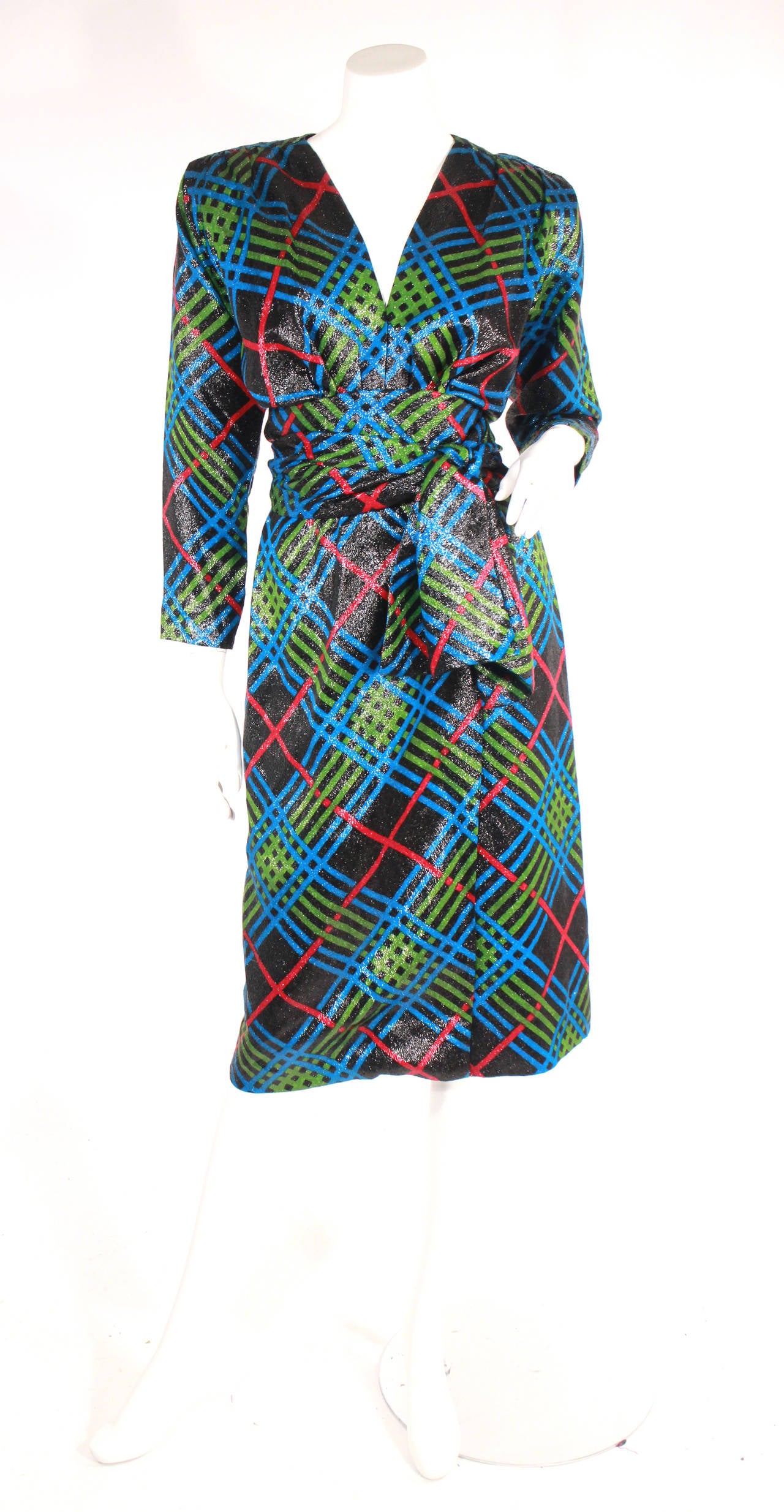 Vintage 1980's YSL wrap dress. Multi color- red, green, blue, fully lined, low neck, shoulder pads, metallic sheen. This dress is perfect for the holidays!!