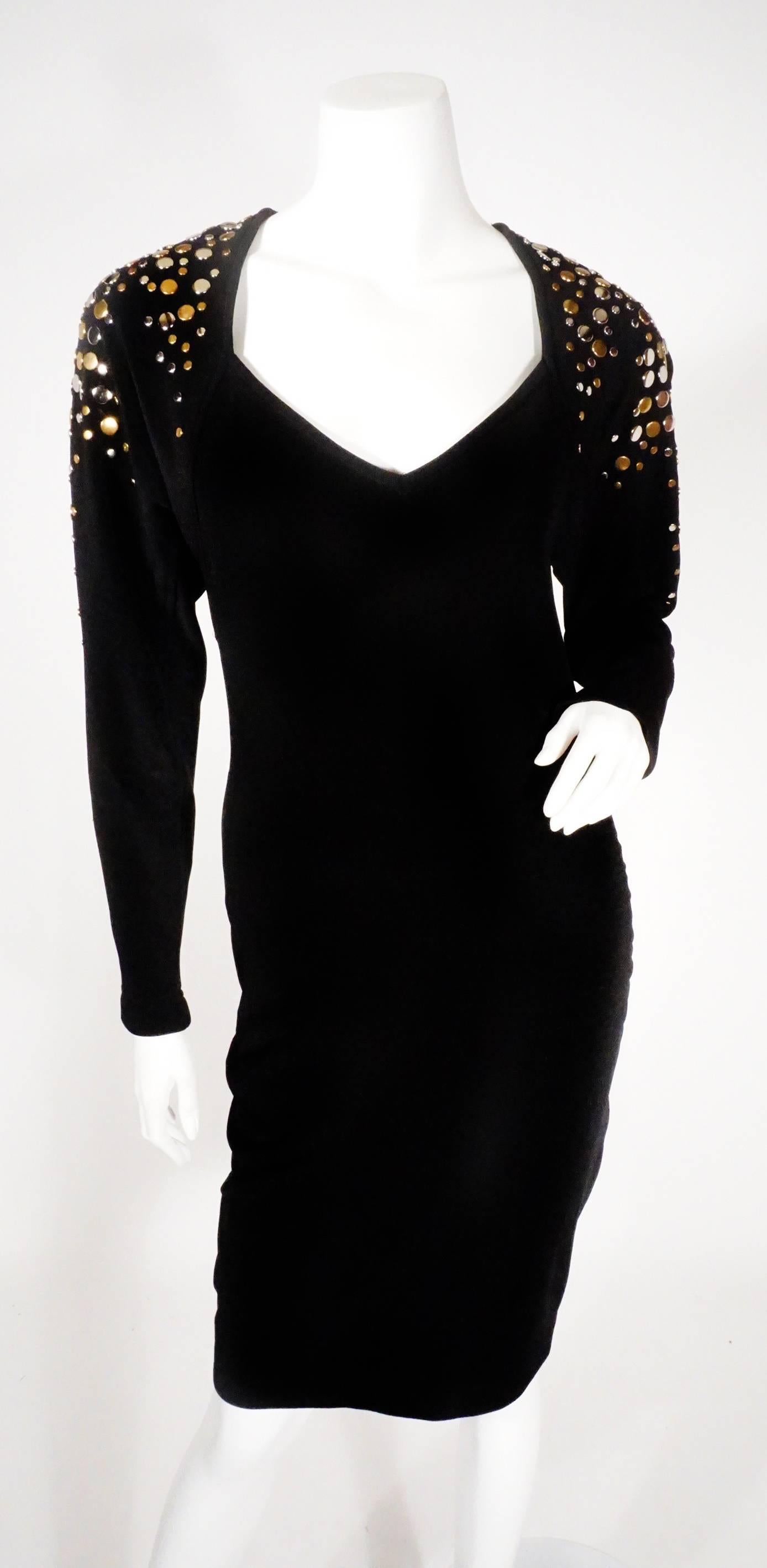 Vintage 1980s Tadashi bodycon dress. Features gold and silver embellishments on the shoulders and v-neck. Sexy open back, form fitting, excellent condition. 