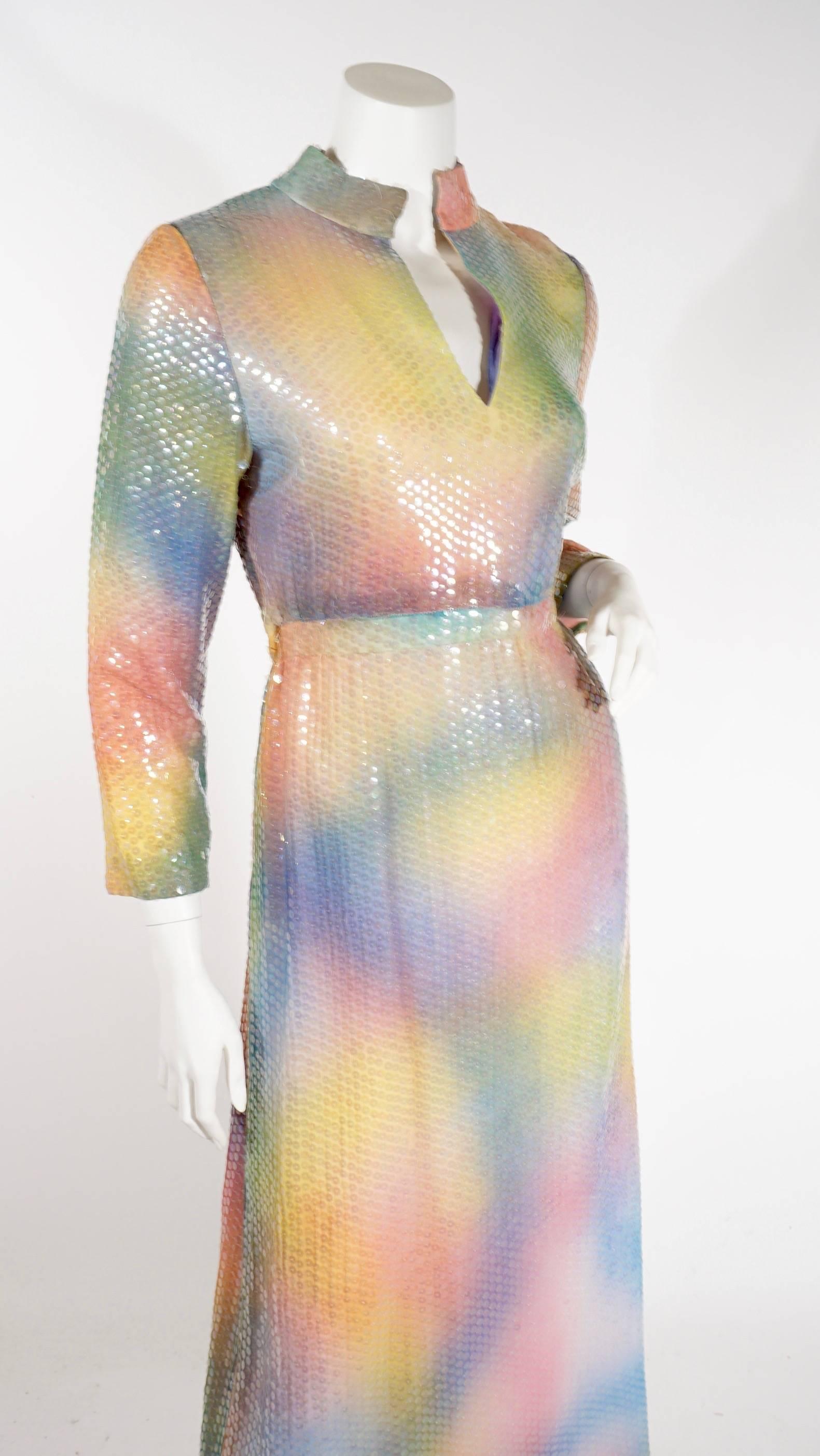 70s Elinor Simmons for Malcolm Starr full length dress. This incredible colorful dress features multi colored sequins, long sleeves, and empire waist. Fully lined, zip back. Excellent condition. Can be worn as is or shortened into a