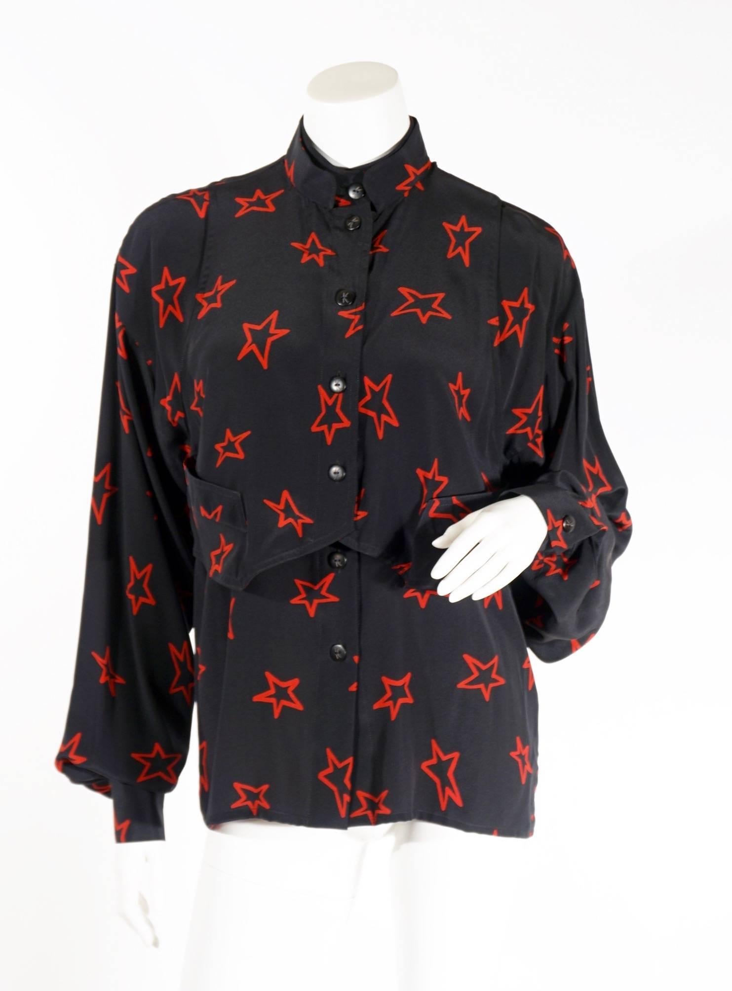 Vintage Krizia silk printed blouse. This flowy top features a super cool star print, double layer ” vest” detail, buttons up the front and at wrist. Perfectly paired to dress up or down. Excellent condition. Can be seen on vetta's website on