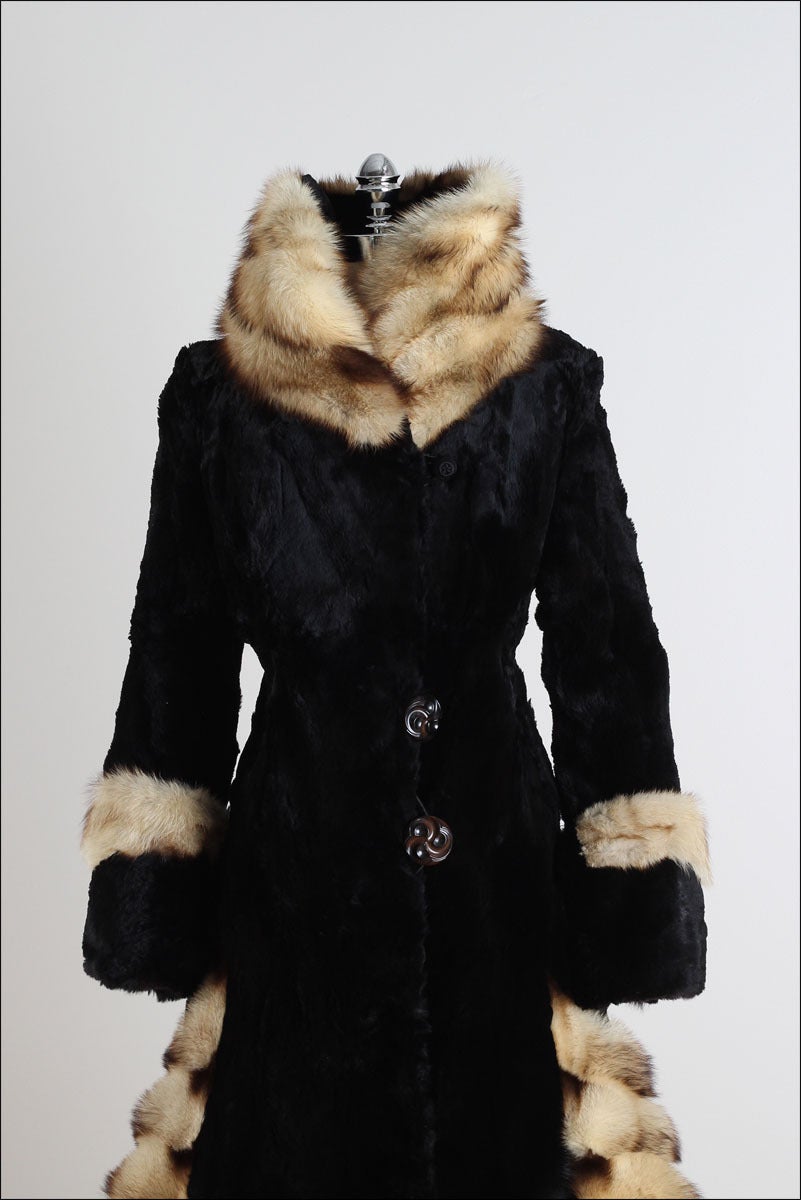 ➳ vintage 1920's coat

* soft sheared beaver fur
* trimmed in Fitch fur
* wide cuffed sleeves
* tall wrapped collar
* two button closure in front
* acetate lining with interior pocket
* incredible style and details
* from Herman & Ben Marks