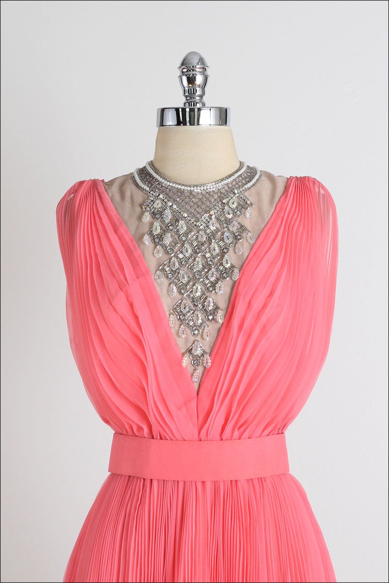 ➳ vintage 1960s dress

* coral pink crepe chiffon
* acetate lining
* pleated skirt
* pearl/beaded/rhinestone bodice
* detached belt
* back zipper
* by Jack Bryan Designed by Dupuis

condition | excellent 

fits like xs/s

length